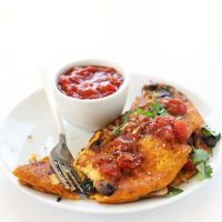 Plate with a Simple Vegan Omelet beside a bowl of salsa