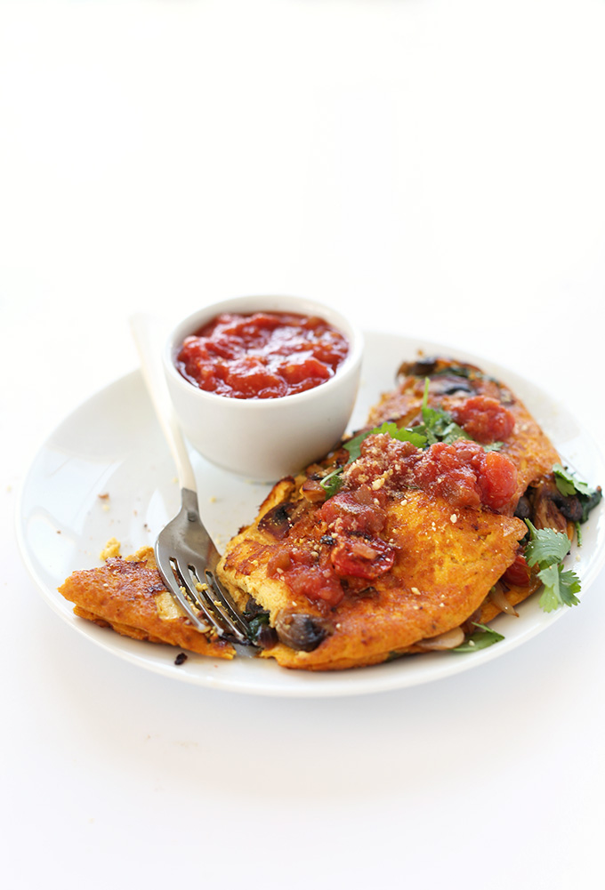 Plate of our Vegan Omelet recipe with a bowl of salsa for serving