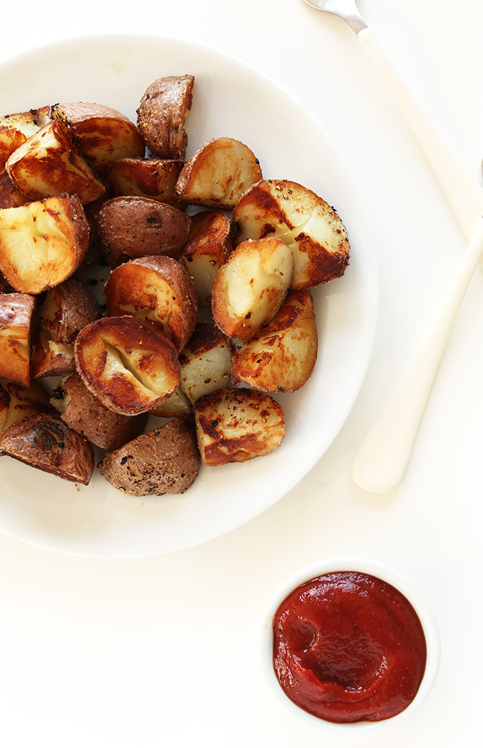 Plate filled with a freshly baked batch of our vegan Breakfast Potatoes