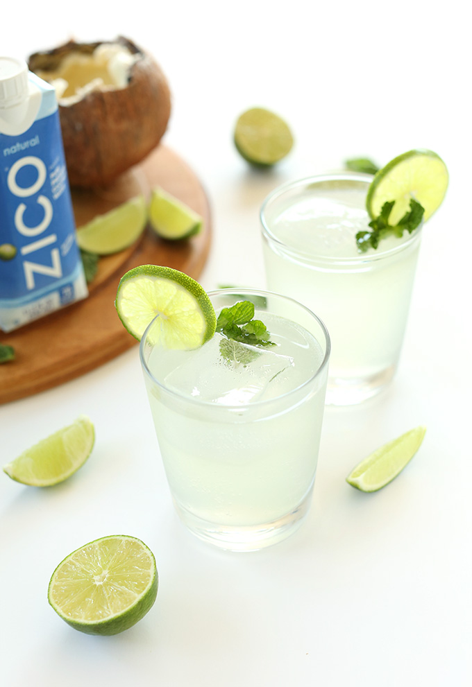 Glasses of Coconut Gin and Tonics with limes and mint