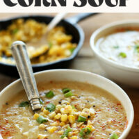 Skillet of corn next to a bowl of simple vegan corn chowder soup
