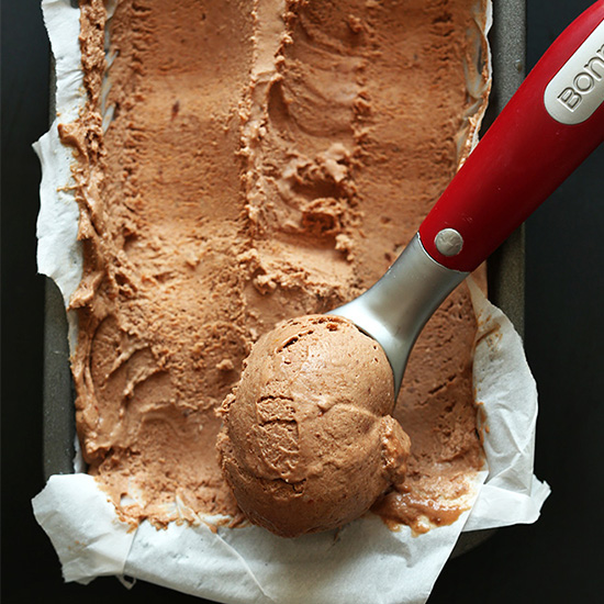 Using an ice cream scooper to scoop up homemade No Churn Vegan Chocolate Ice Cream