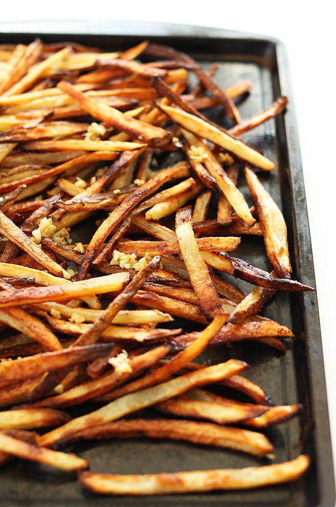 Baking sheet filled with super crispy Baked Matchstick Garlic Fries