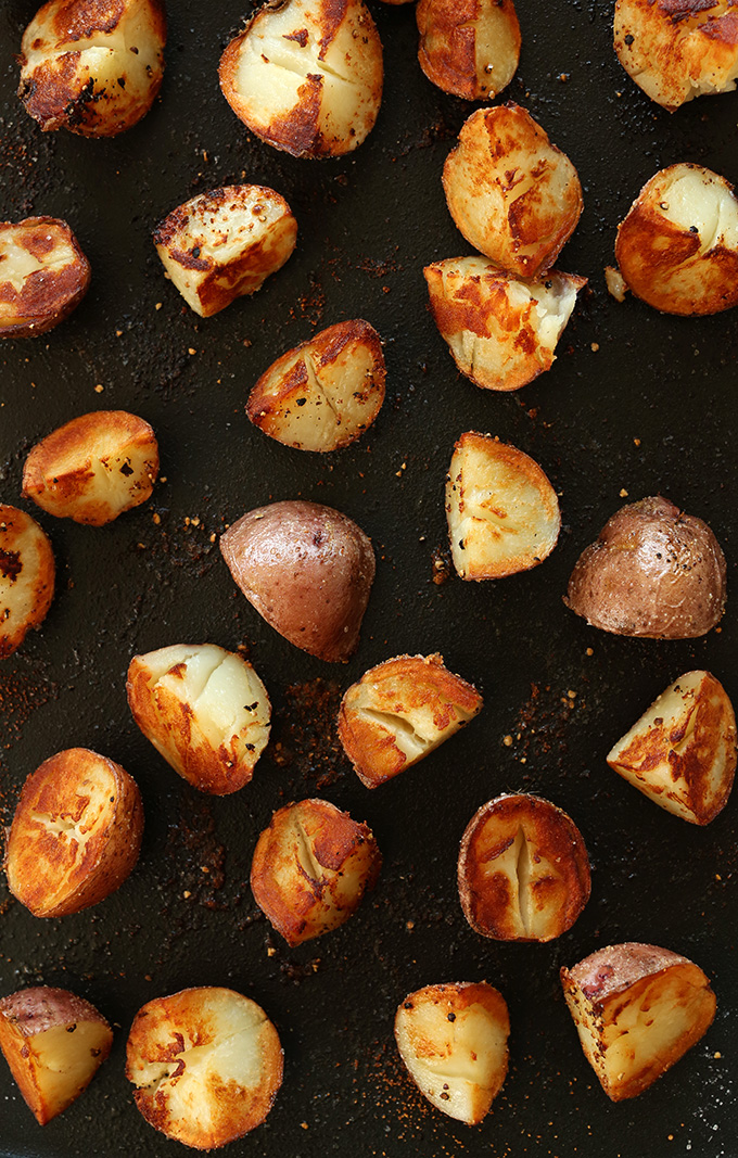 Baking sheet filled with a batch of crispy vegan breakfast potatoes