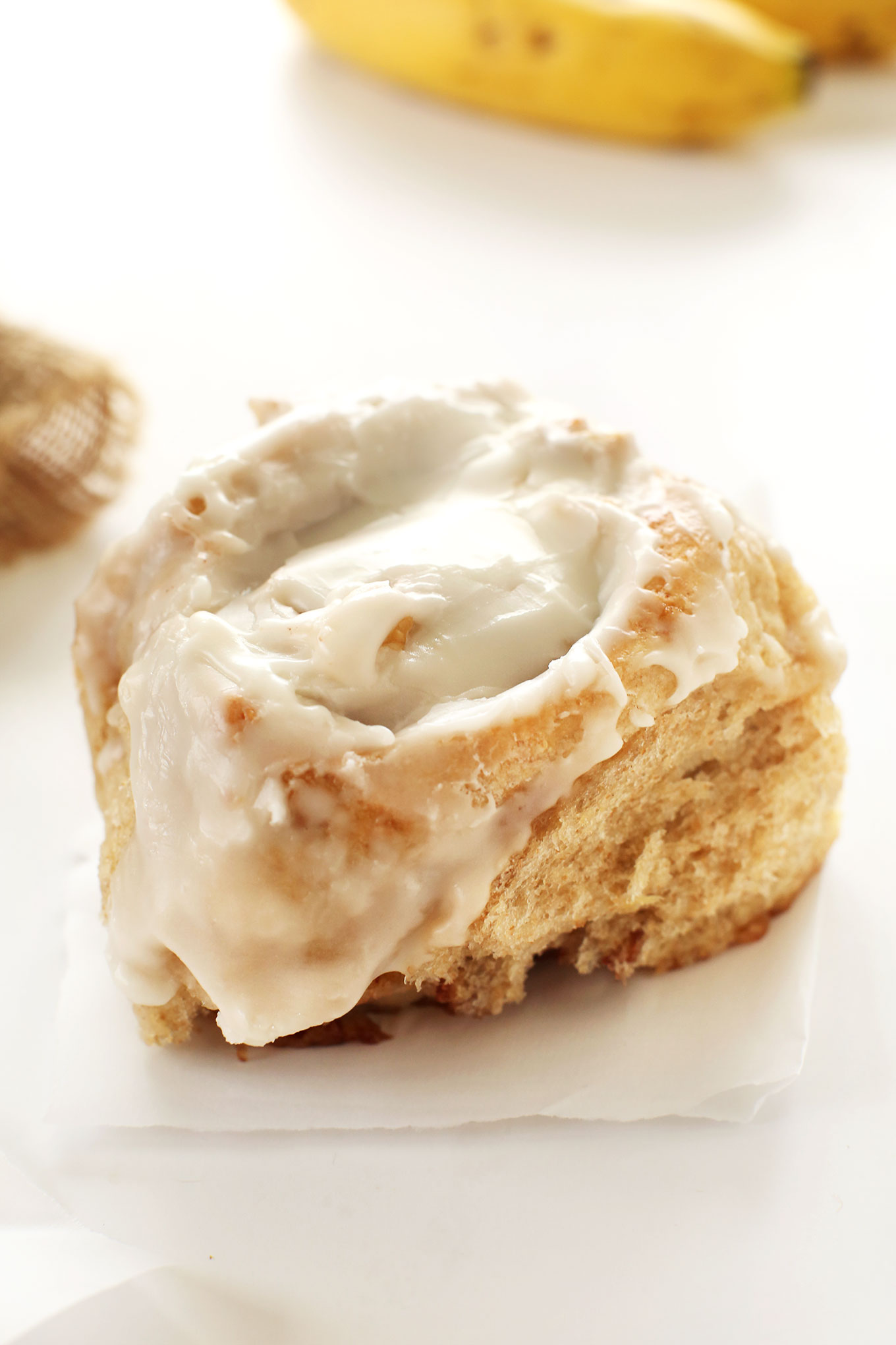 Close up shot of a Banana Bread Cinnamon Roll made with our quick and easy vegan recipe