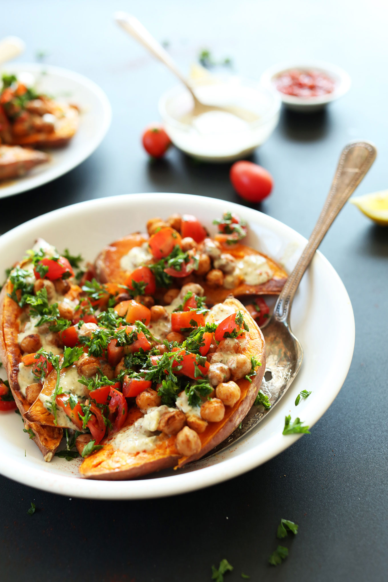 Close up shot of a bowl of gluten-free vegan Mediterranean Baked Sweet Potatoes