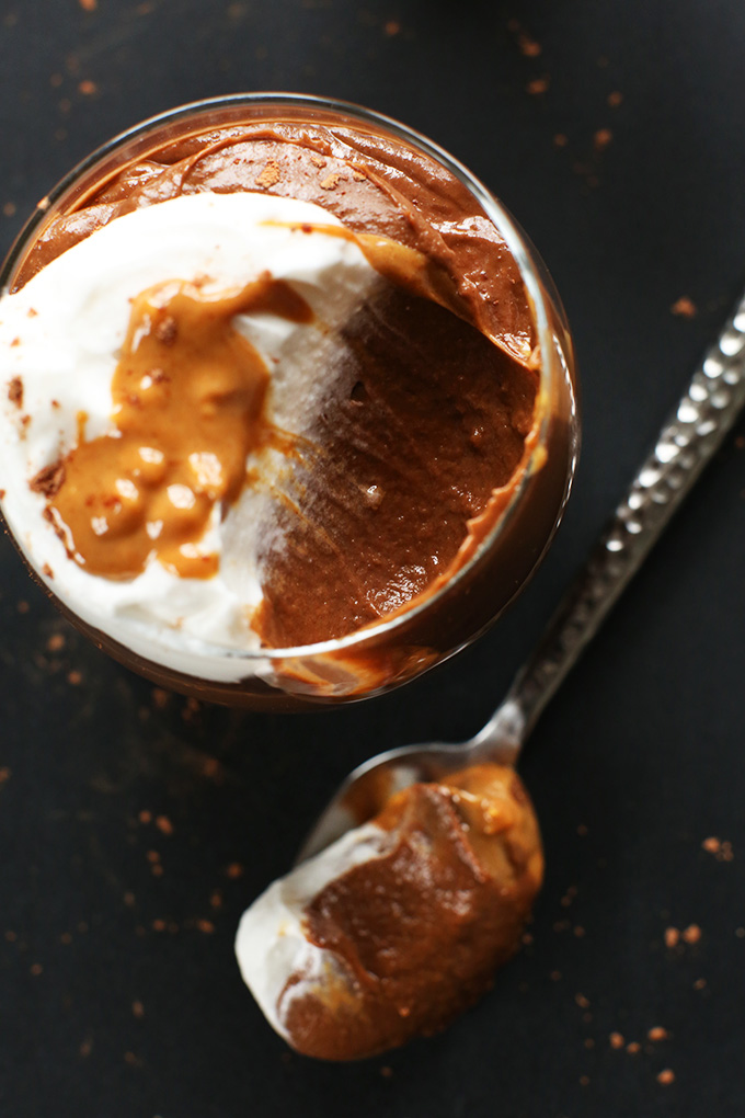 Glass jar of Chocolate Peanut Butter Pudding with a bite removed