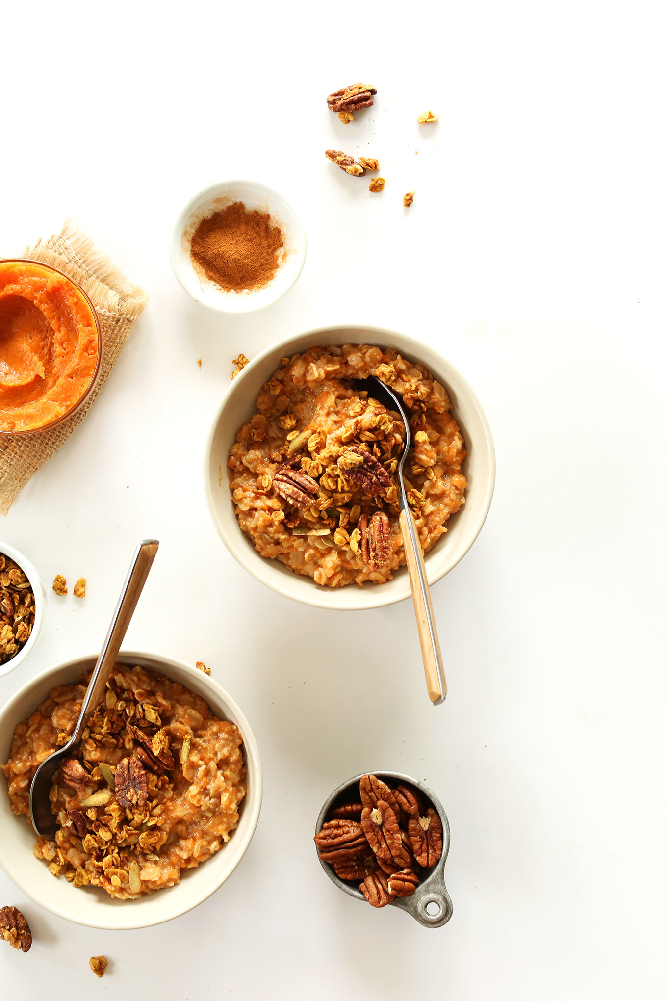 Bowls of our healthy Sweet Potato Pie Oats topped with pecans