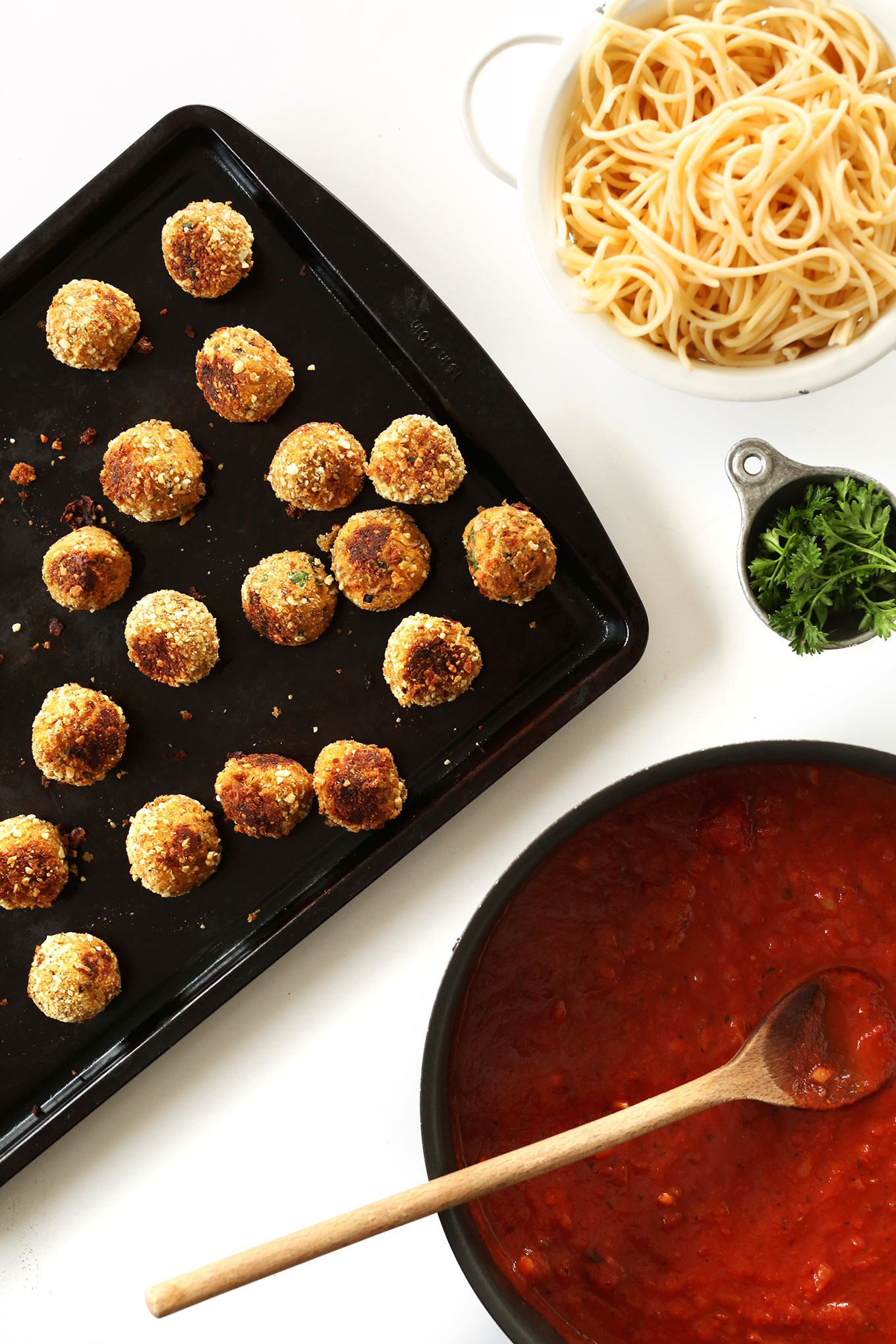 Vegan meatballs, pasta, parsley, and marinara for the perfect vegan meal