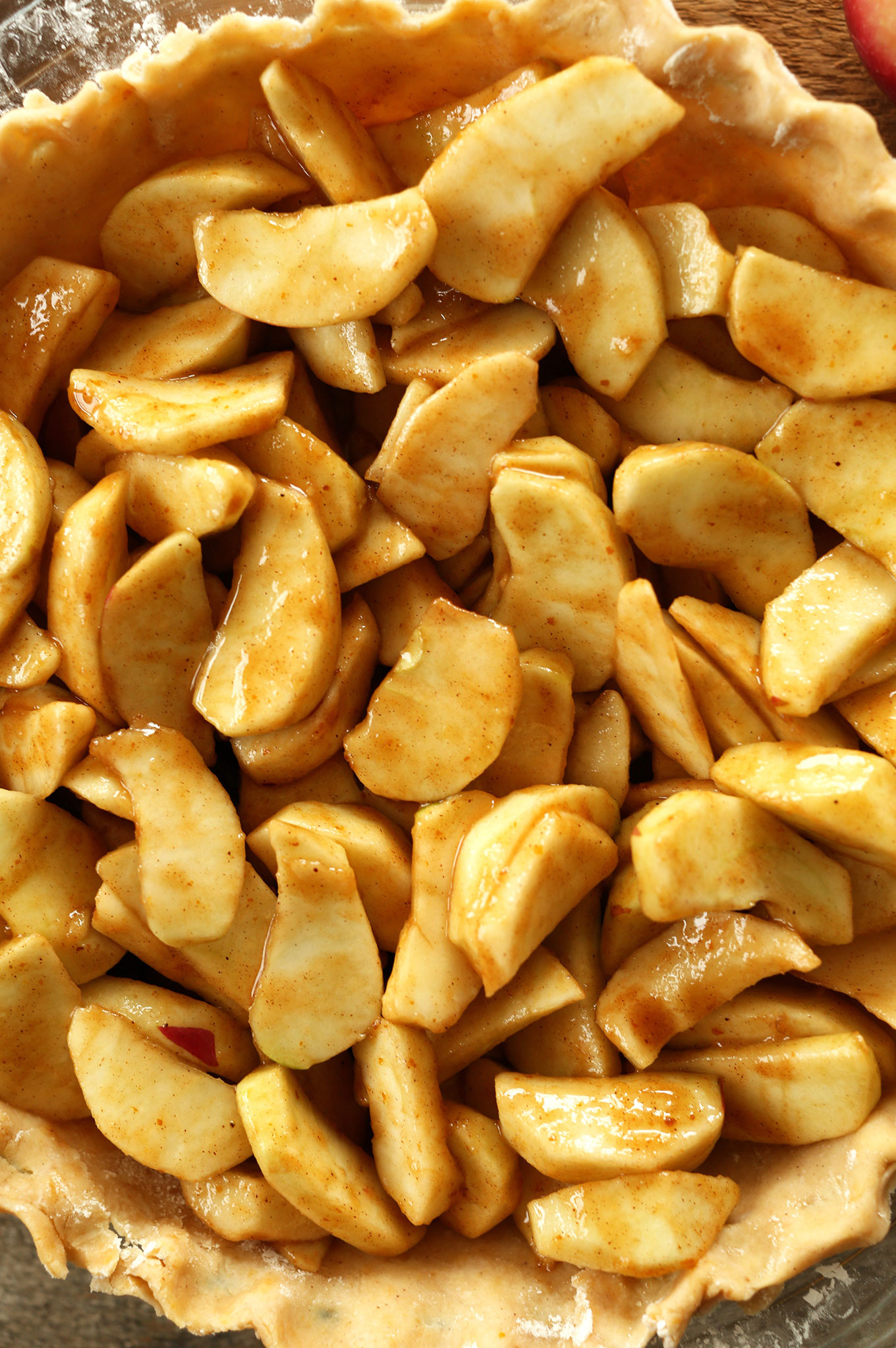Seasoned apples in a pie crust for Vegan Pumpkin Spiced Apple Pie