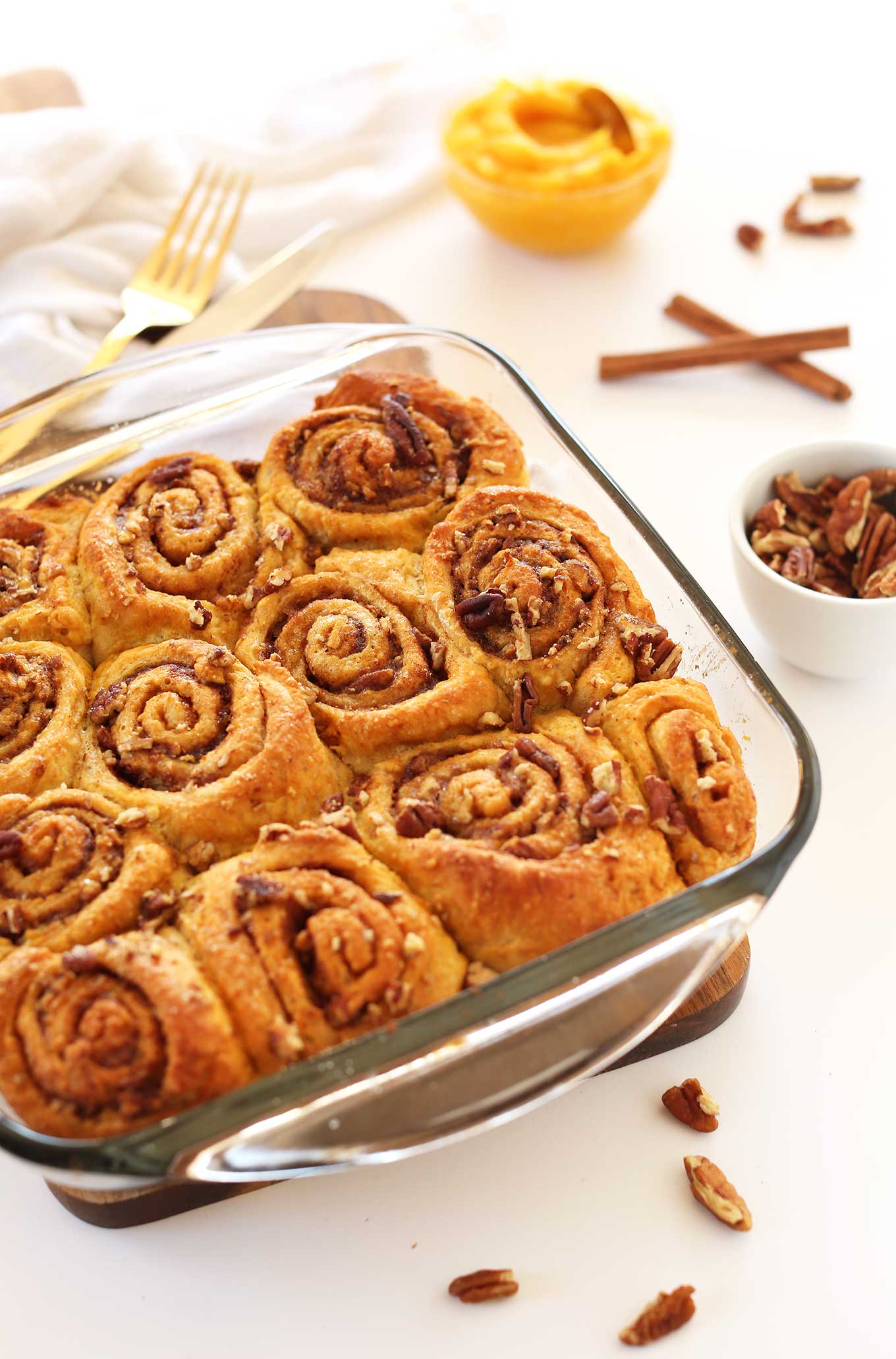 Close up shot of a pan of Vegan Pumpkin Cinnamon Rolls