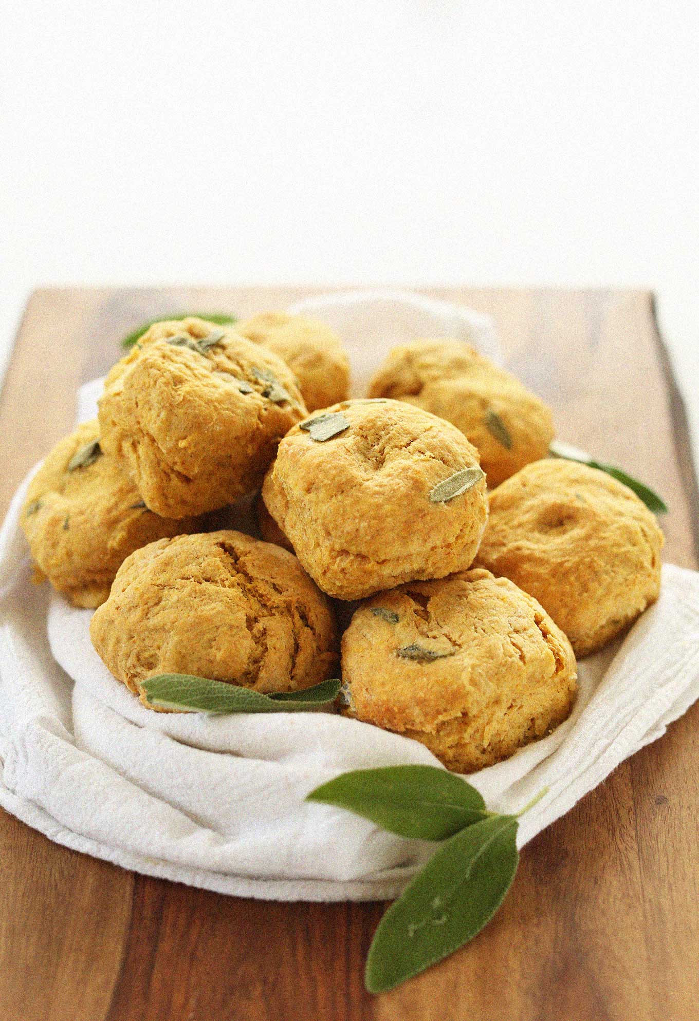 Batch of our Pumpkin Sage Biscuits recipe resting on a cutting board