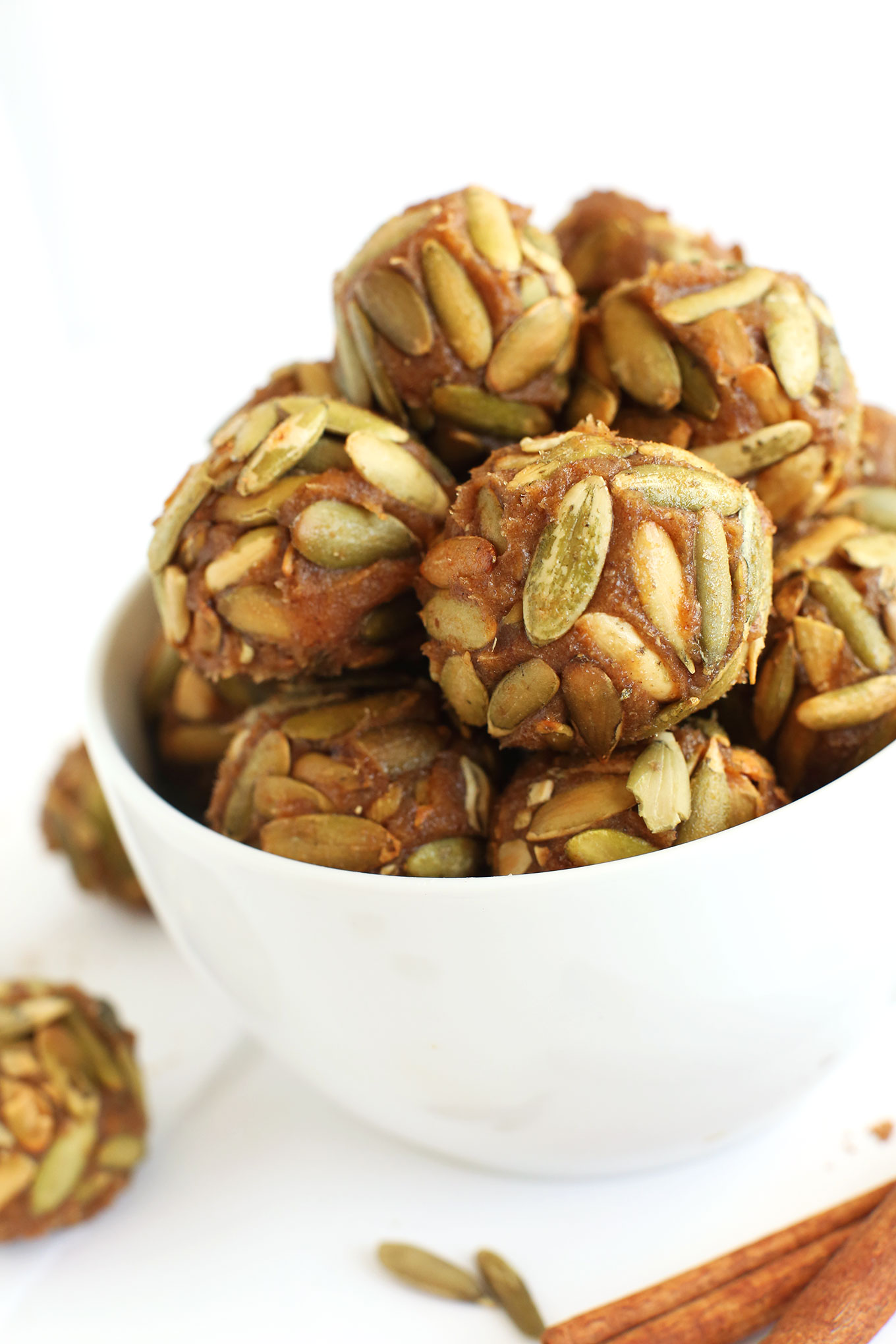 Close up shot of Vegan Pumpkin Caramels rolled in pumpkin seeds