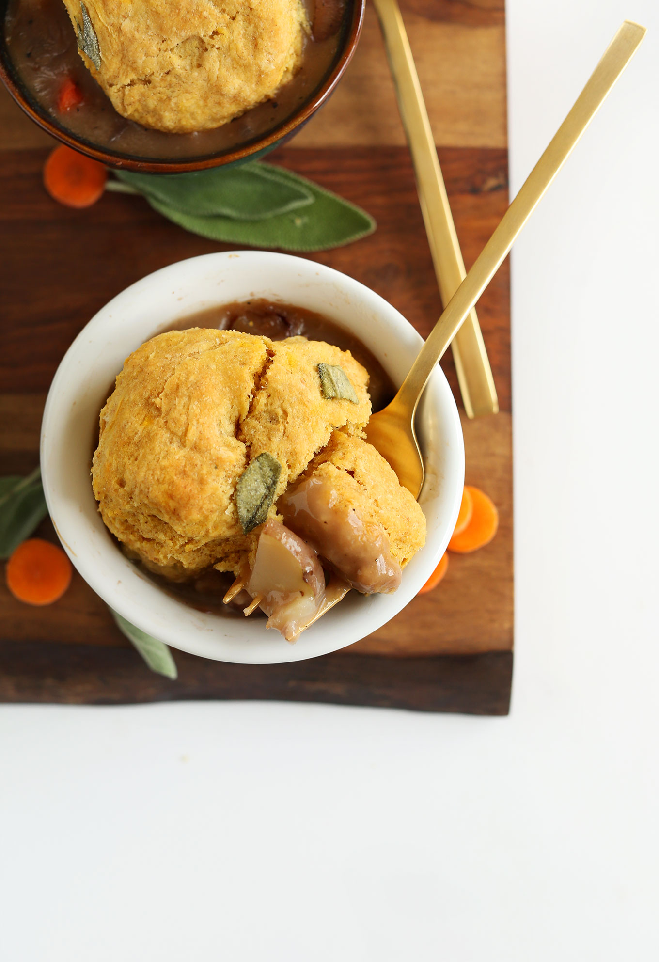 Fork holding a bite of Fall Pot Pie for a vegan dinner