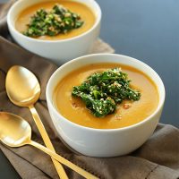 Bowls of our Simple Pumpkin Soup recipe with a Sesame Kale Topping