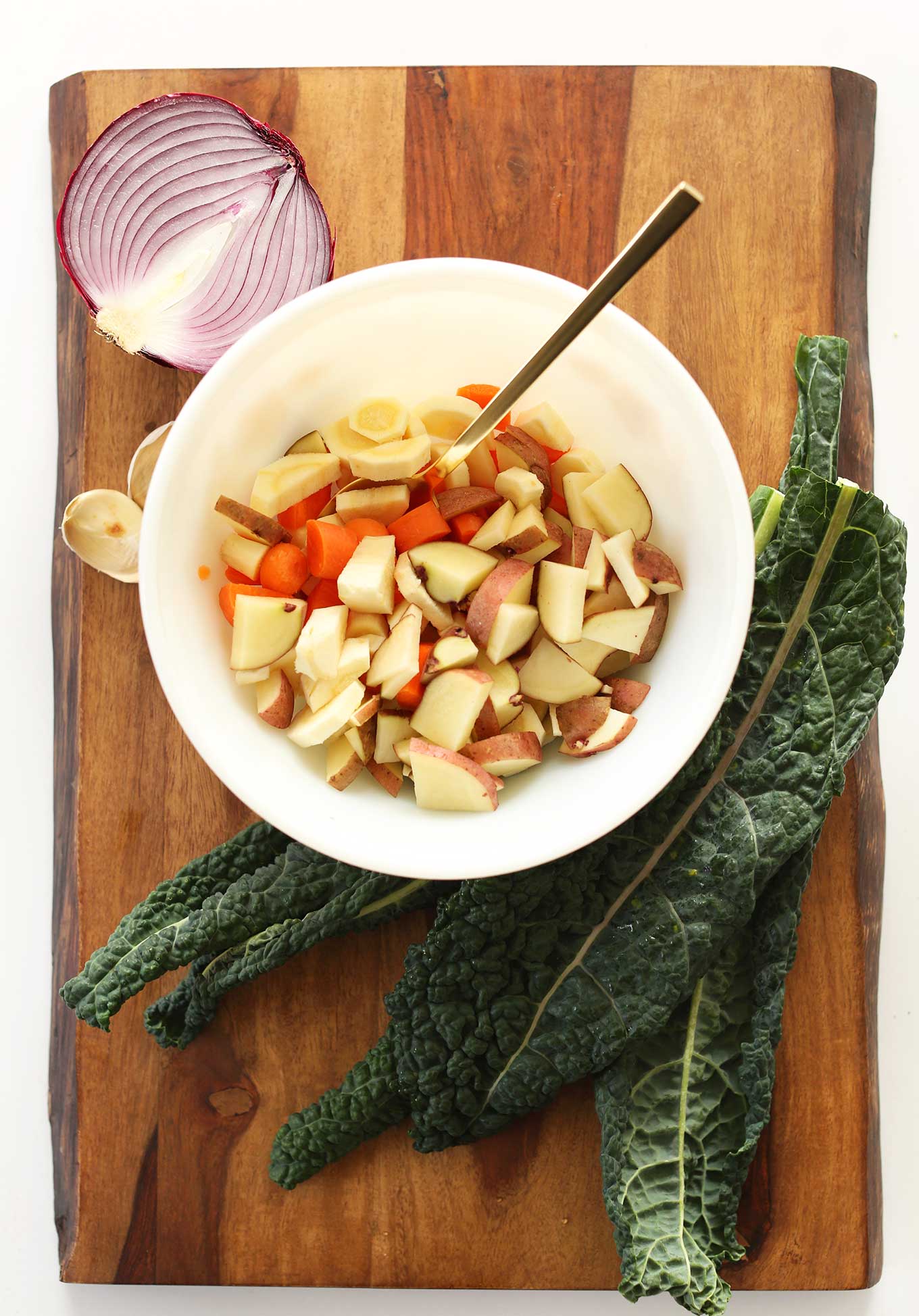 Cutting board with vegetables for making healthy Vegan Fall Pot Pies
