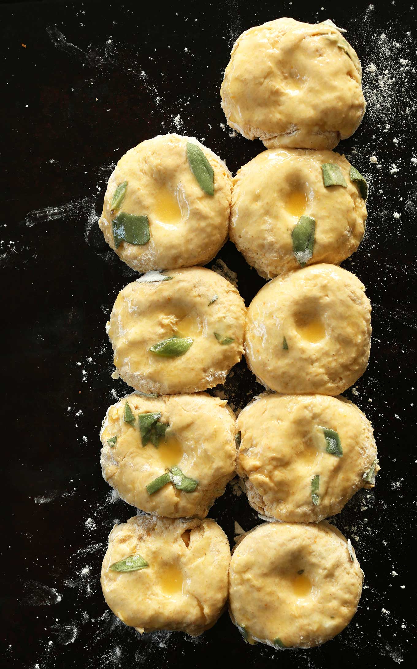 Baking sheet filled with Pumpkin Sage Biscuits ready to go in the oven