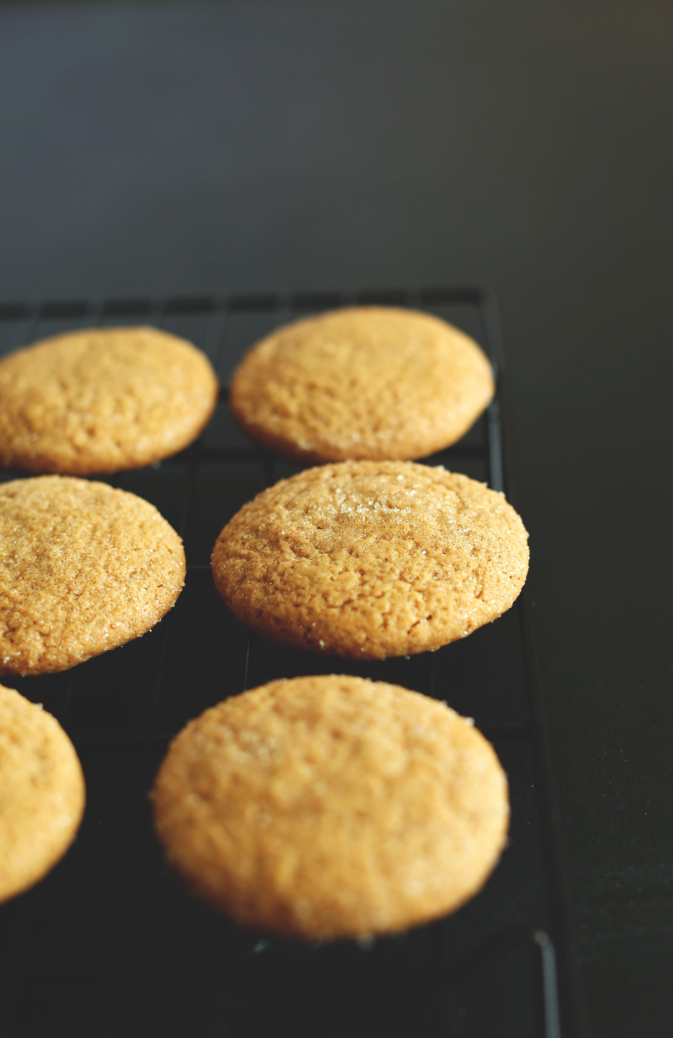 Freshly baked Vegan Pumpkin Sugar Cookies resting on a cooling rack