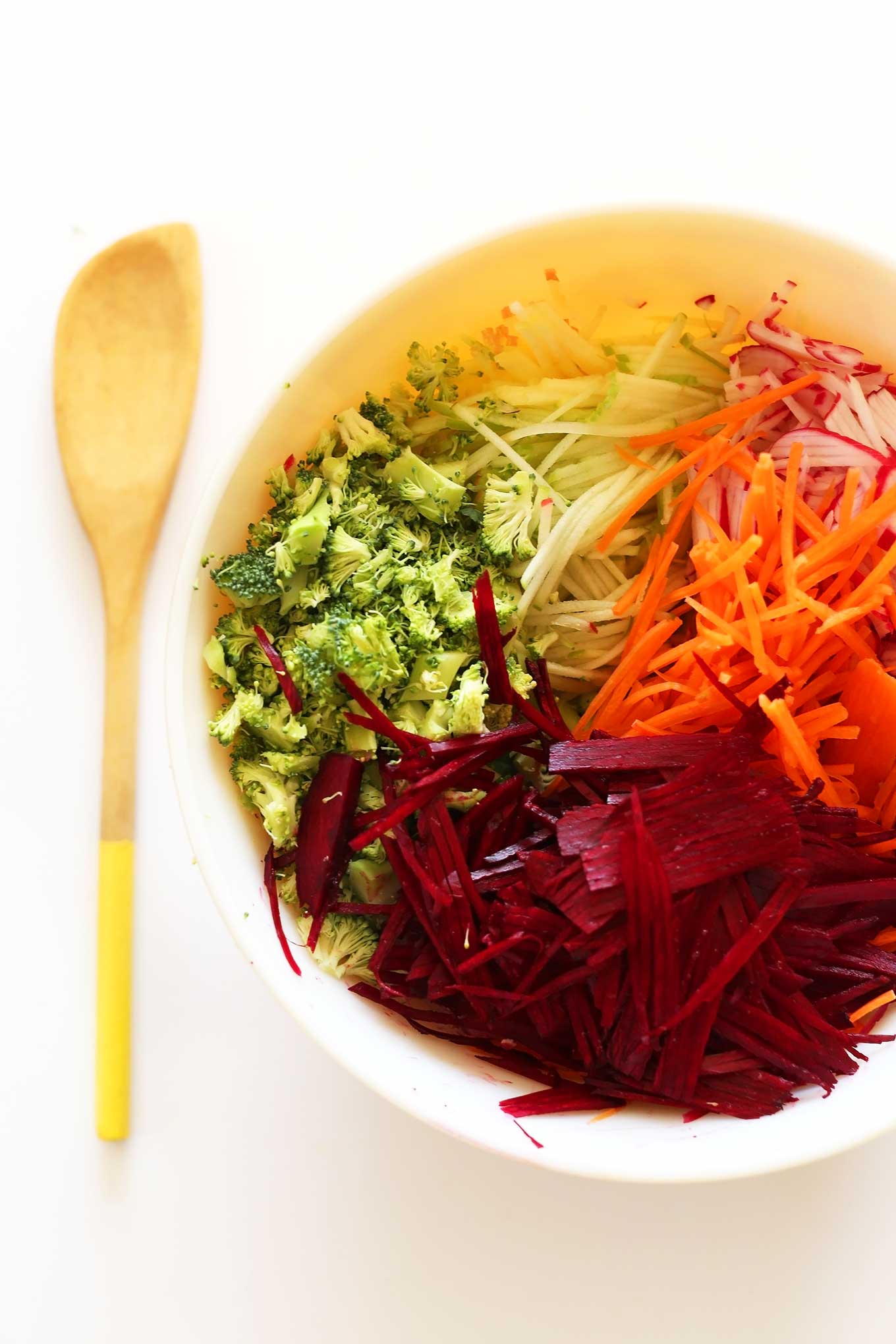 Freshly sliced vegetables in a bowl for our healthy fall slaw