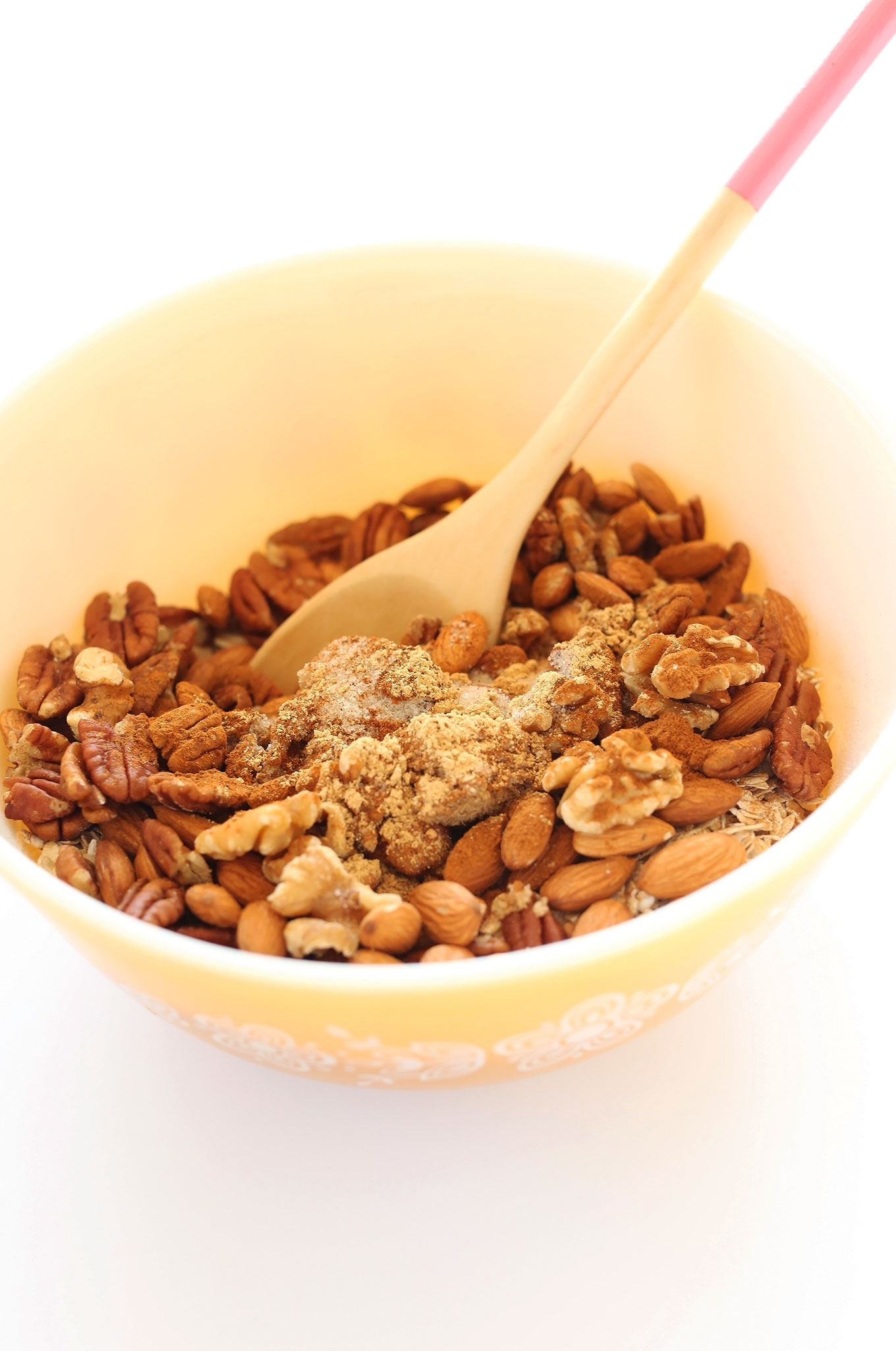 Stirring together ingredients for our Gingerbread Granola recipe