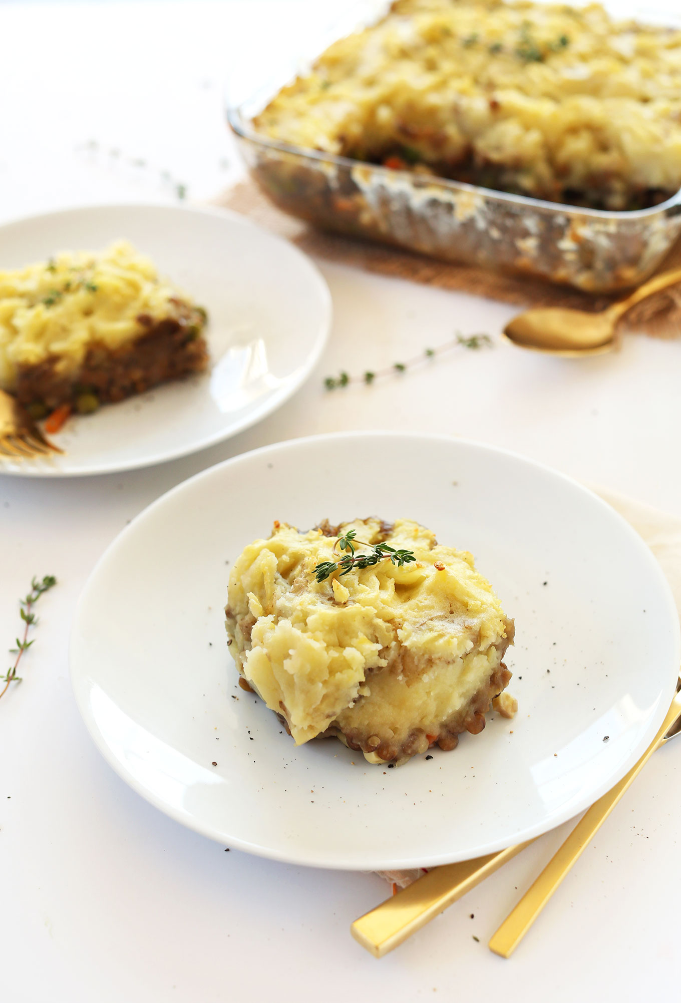 Plates and baking pan of our Lentil Shepherds Pie recipe