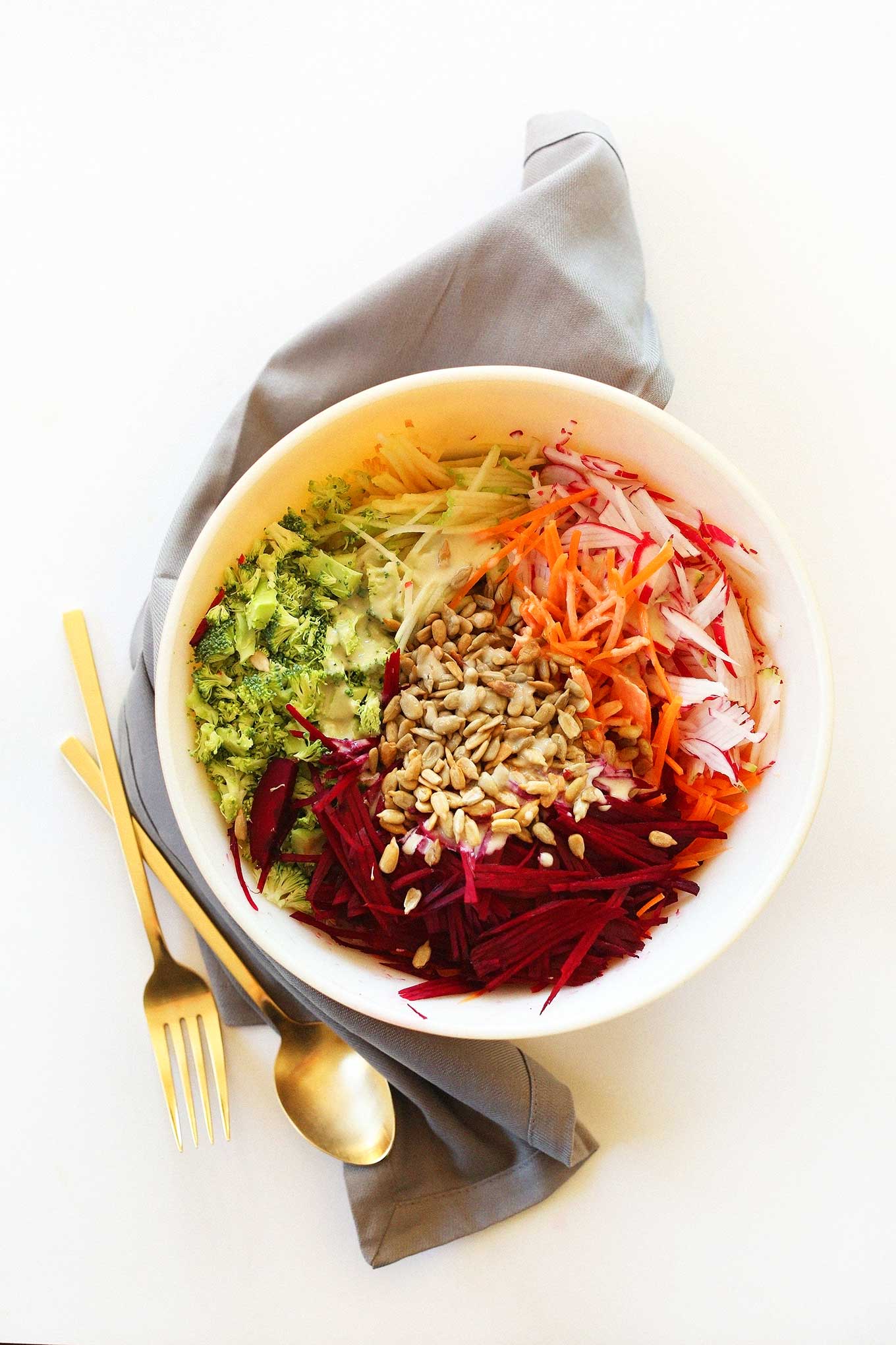 Big bowl of our healthy fall slaw topped with sunflower seeds