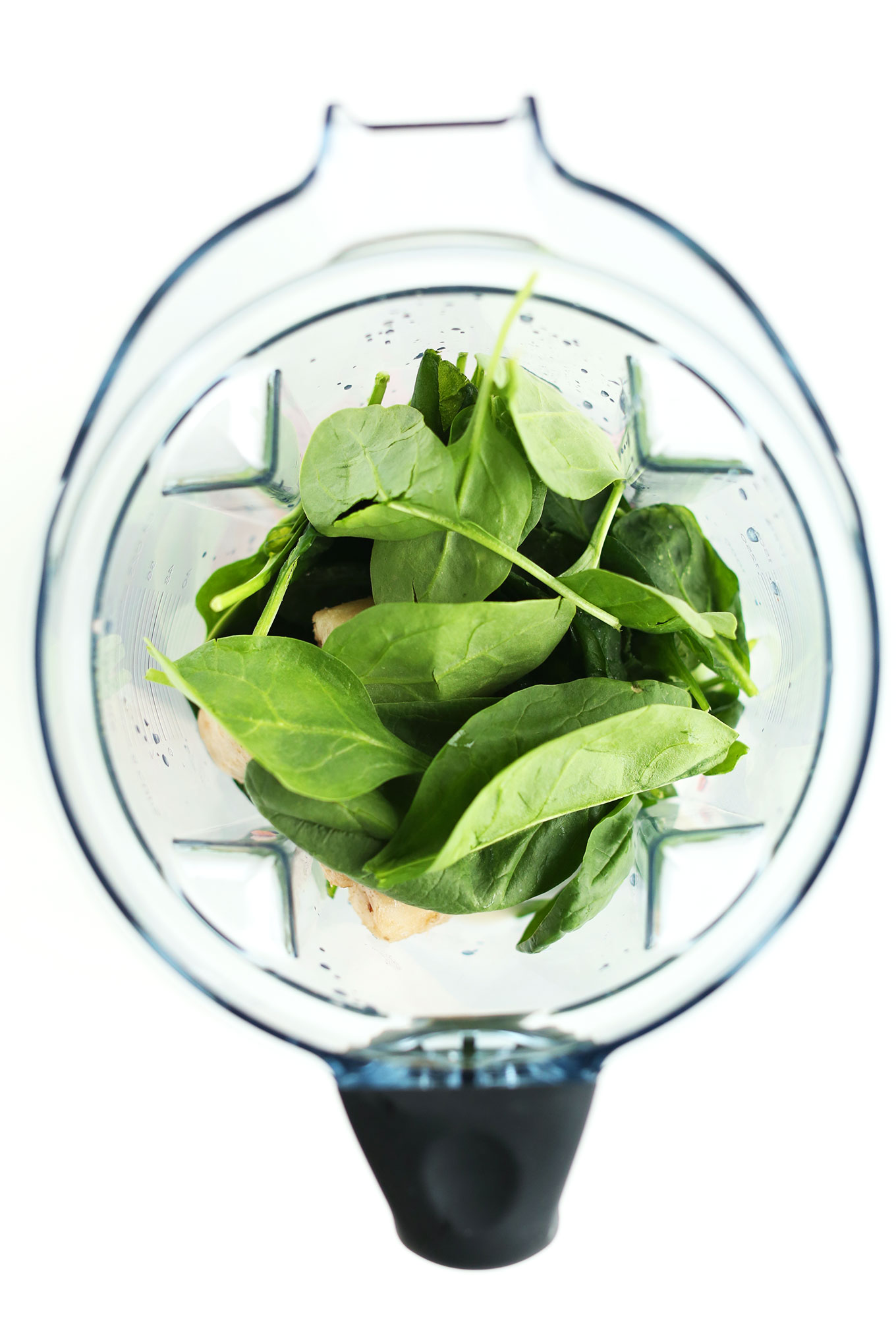 Blender with ingredients for making our Grapefruit Green Smoothie recipe