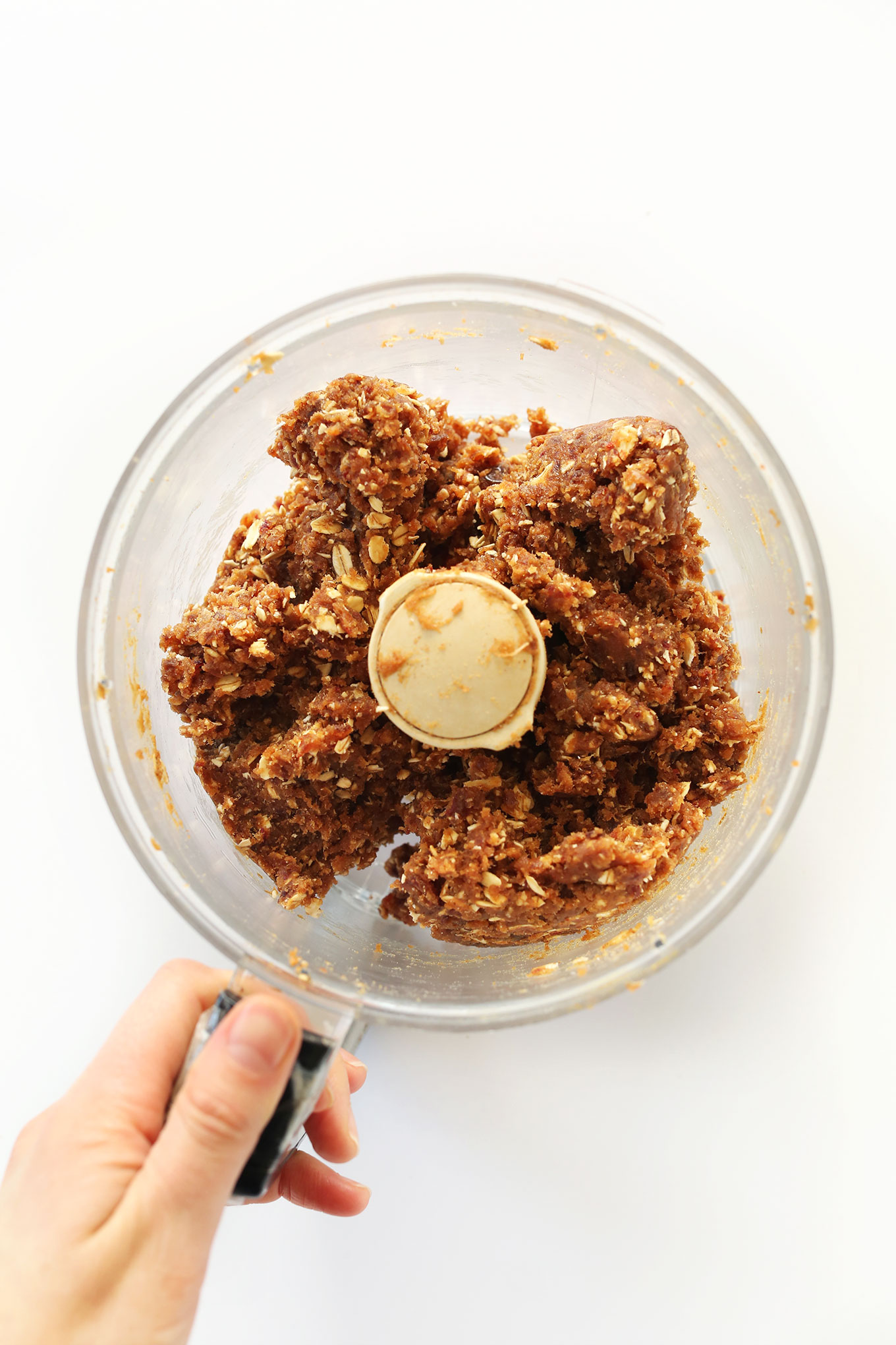 Food processor with freshly blended Copycat Peanut Butter Larabars