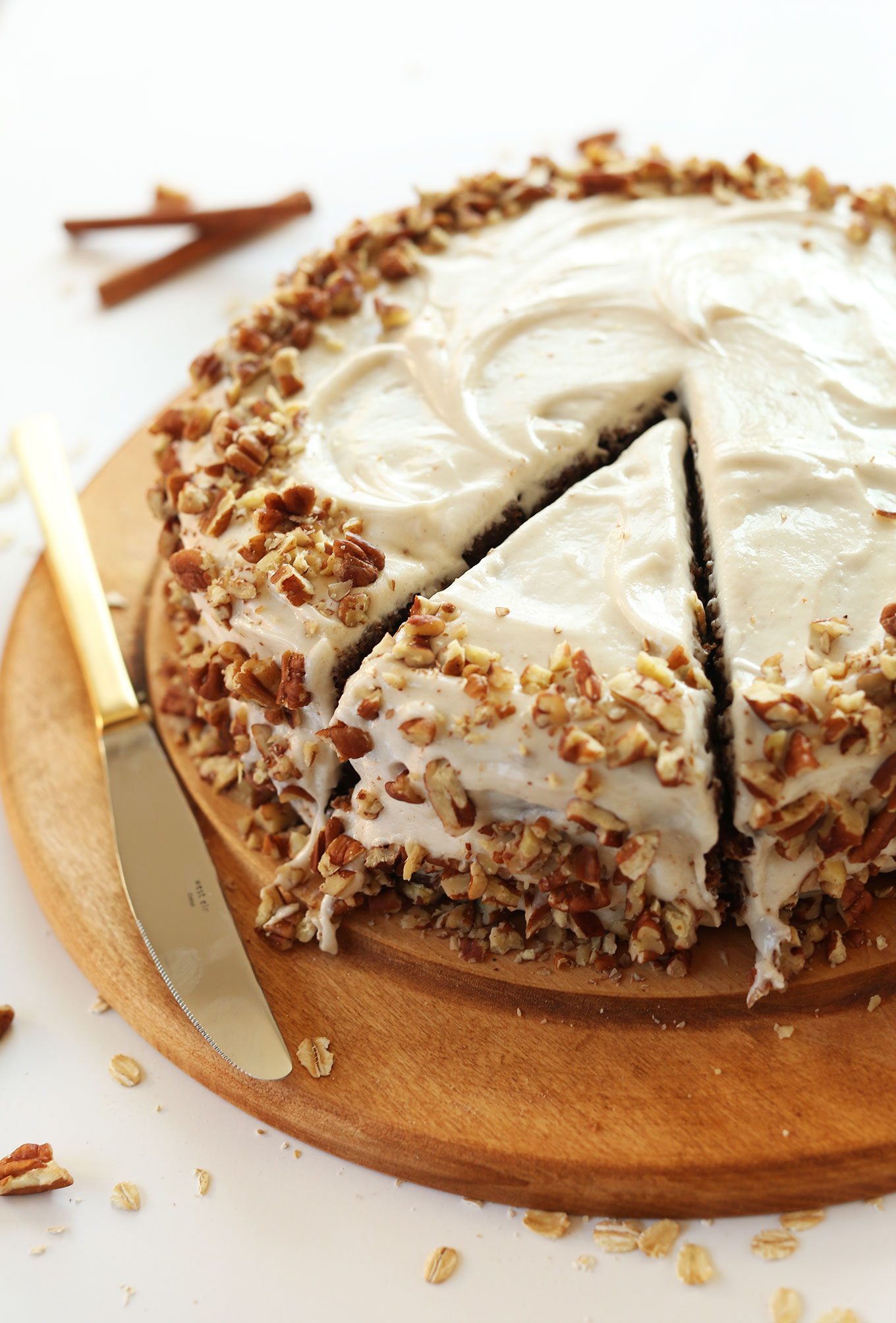 Cut slice of Apple Gingerbread Cake with Vegan Cream Cheese Frosting