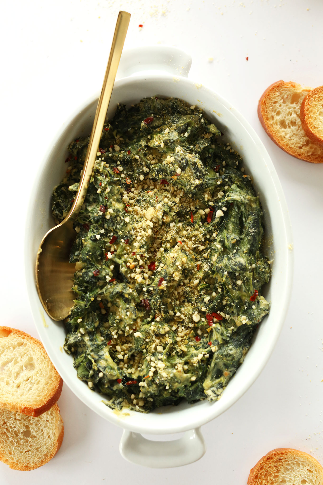 Ceramic dish filled with our Creamy vegan Kale and Spinach Dip