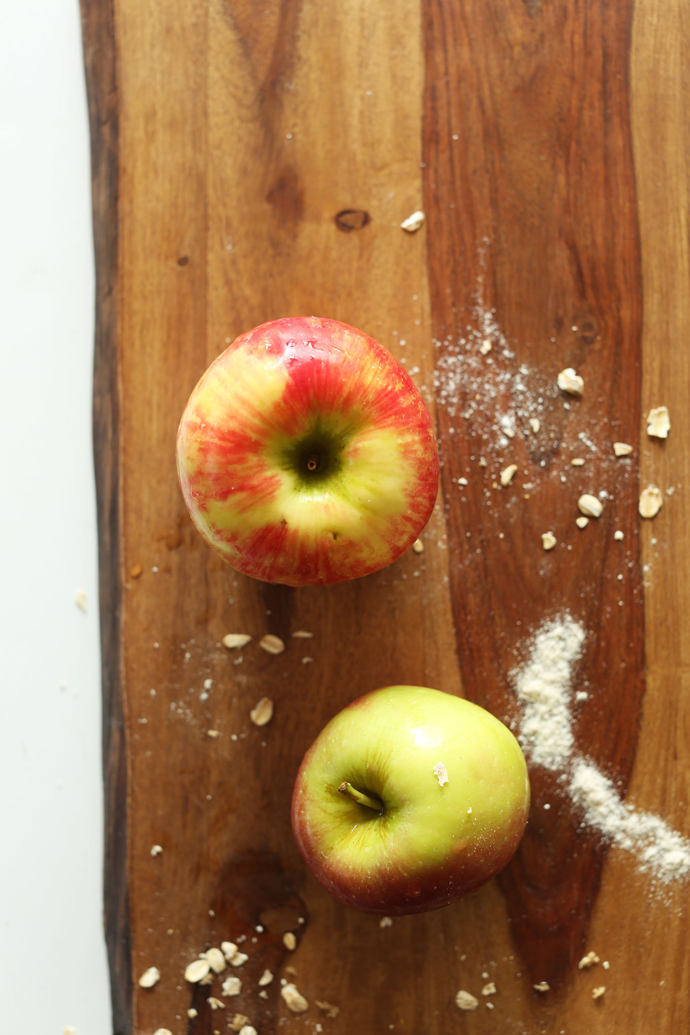 Cutting board with apples for making vegan Apple Gingerbread Cake