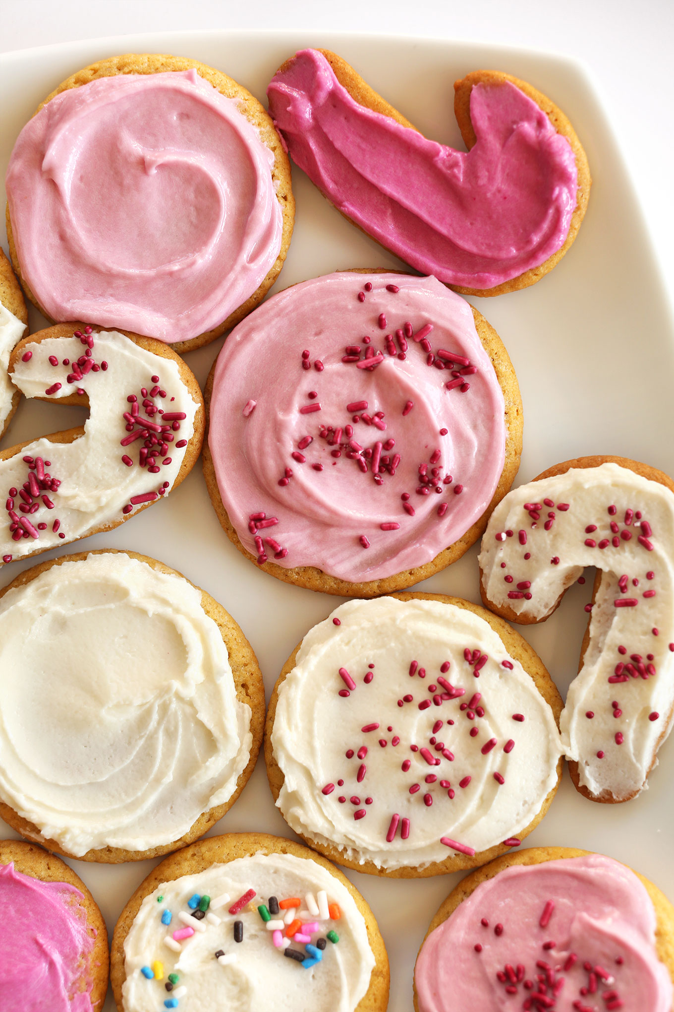 Plate of frosted cookies made using our Classic Vegan Sugar Cookies recipe