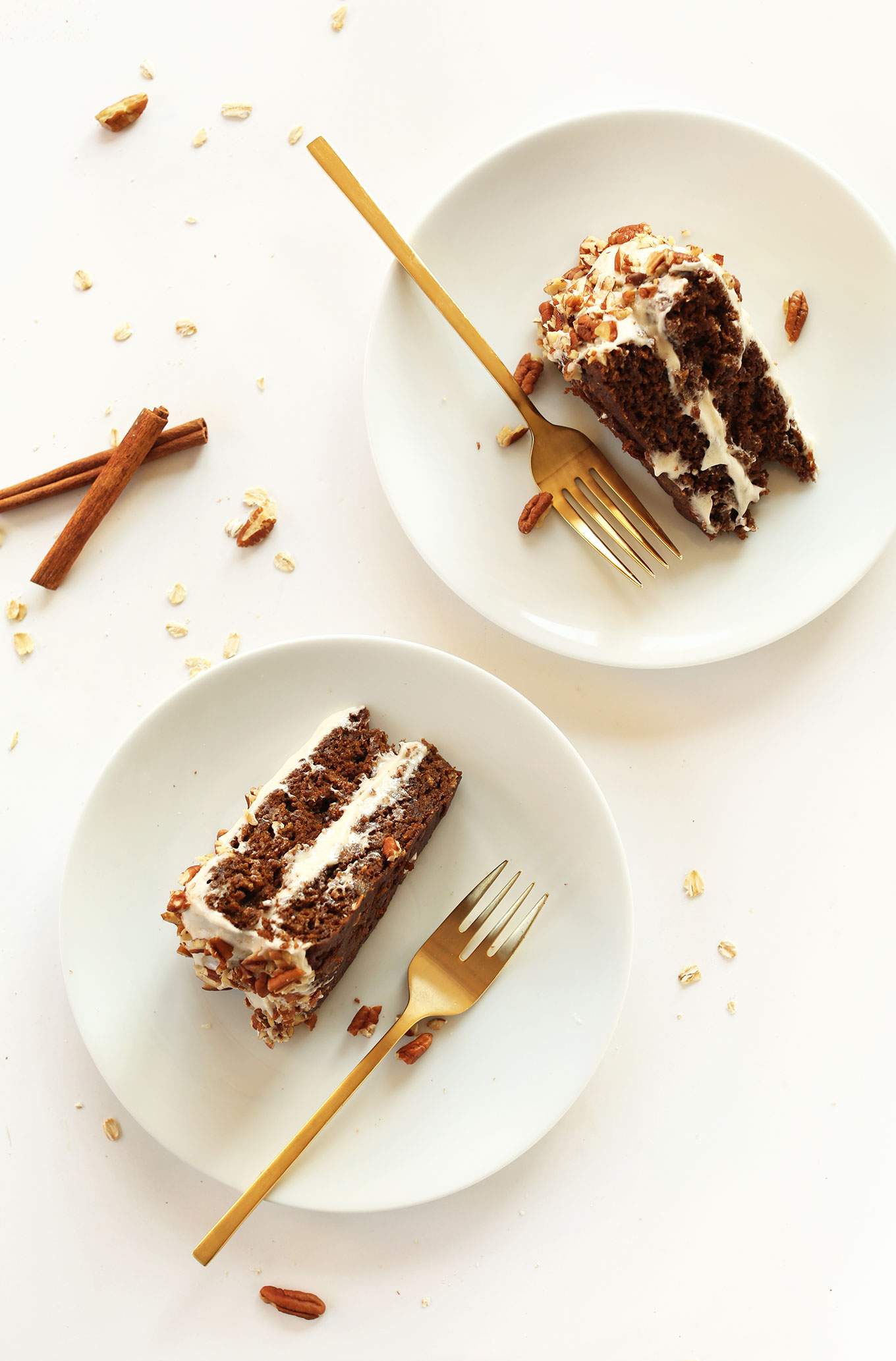 Dessert plates with slices of Apple Gingerbread Cake with Vegan Cream Cheese Frosting