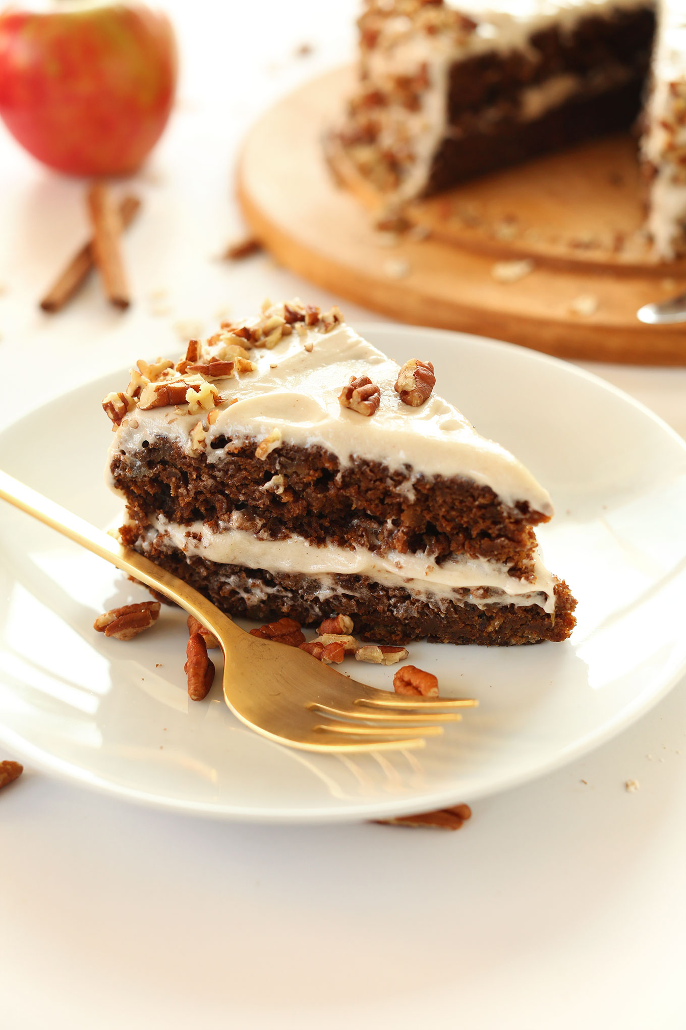 Slice of delicious Apple Gingerbread Cake with Vegan Cream Cheese Frosting