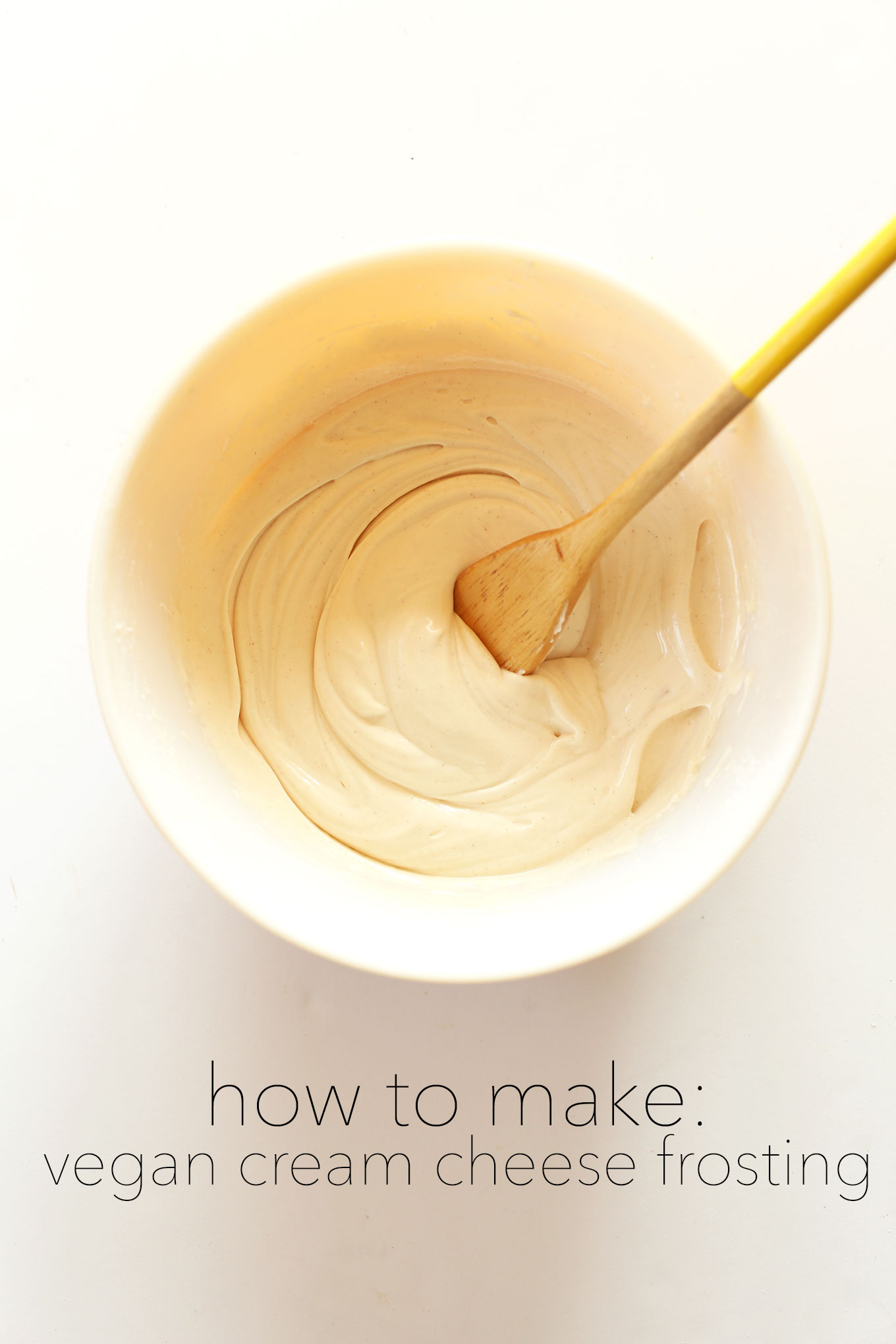 Stirring a bowl of our homemade Vegan Cream Cheese Frosting