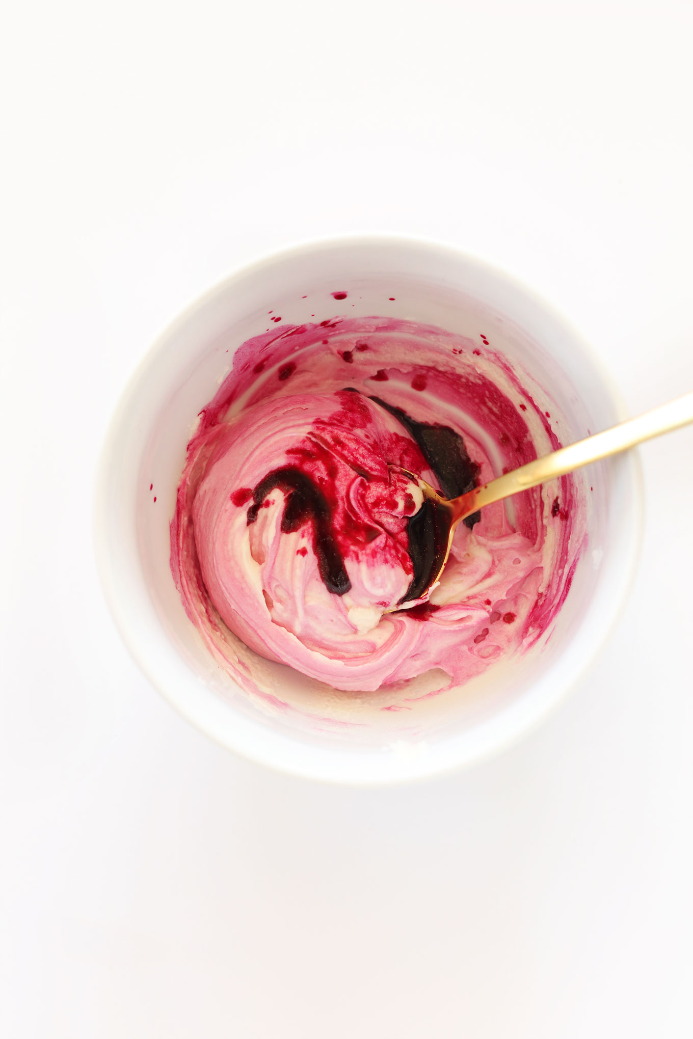 Bowl of pink frosting made with our Natural Food Coloring Recipe