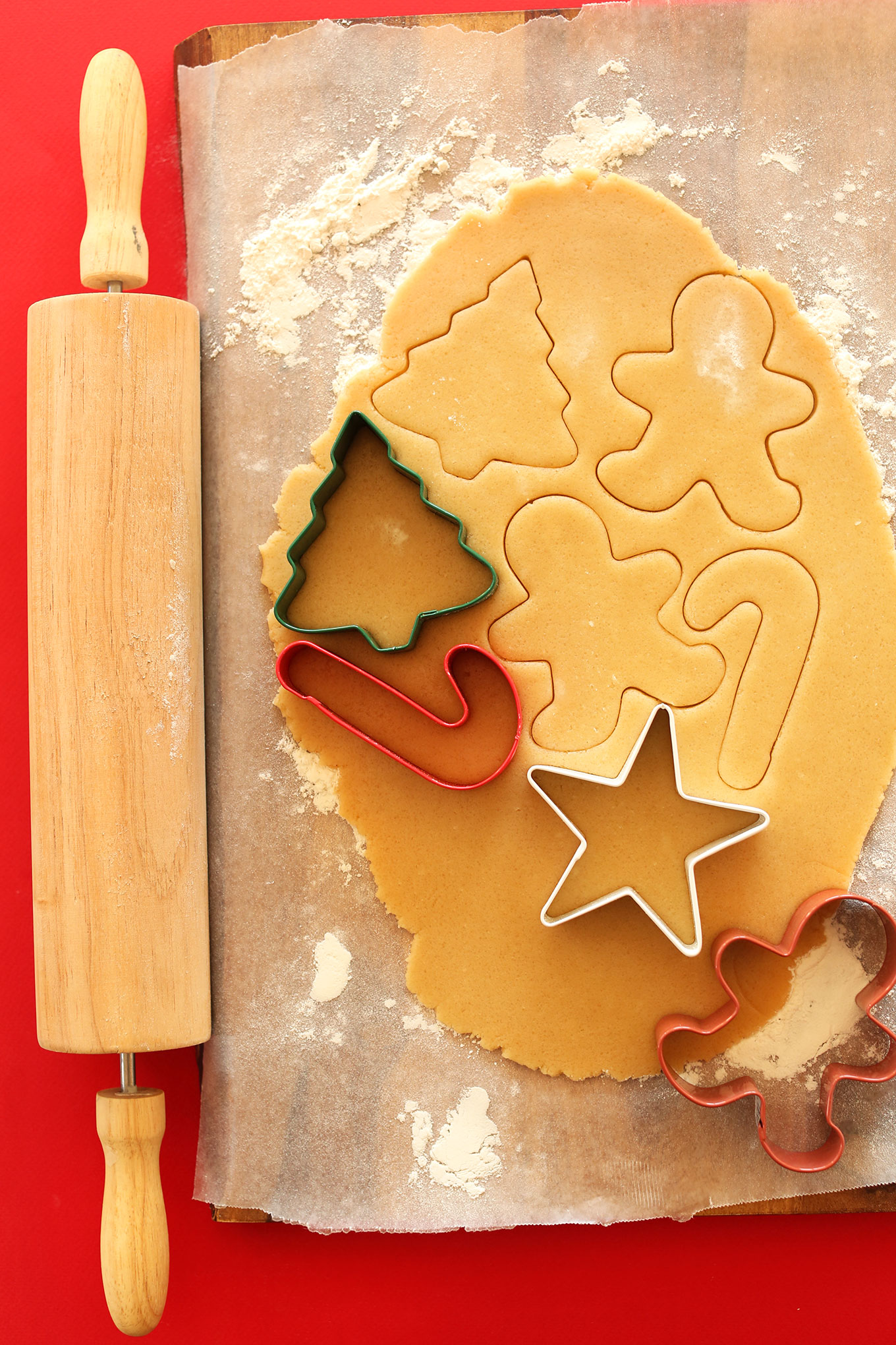 Using cookie cutters to cut out perfect Vegan Sugar Cookies