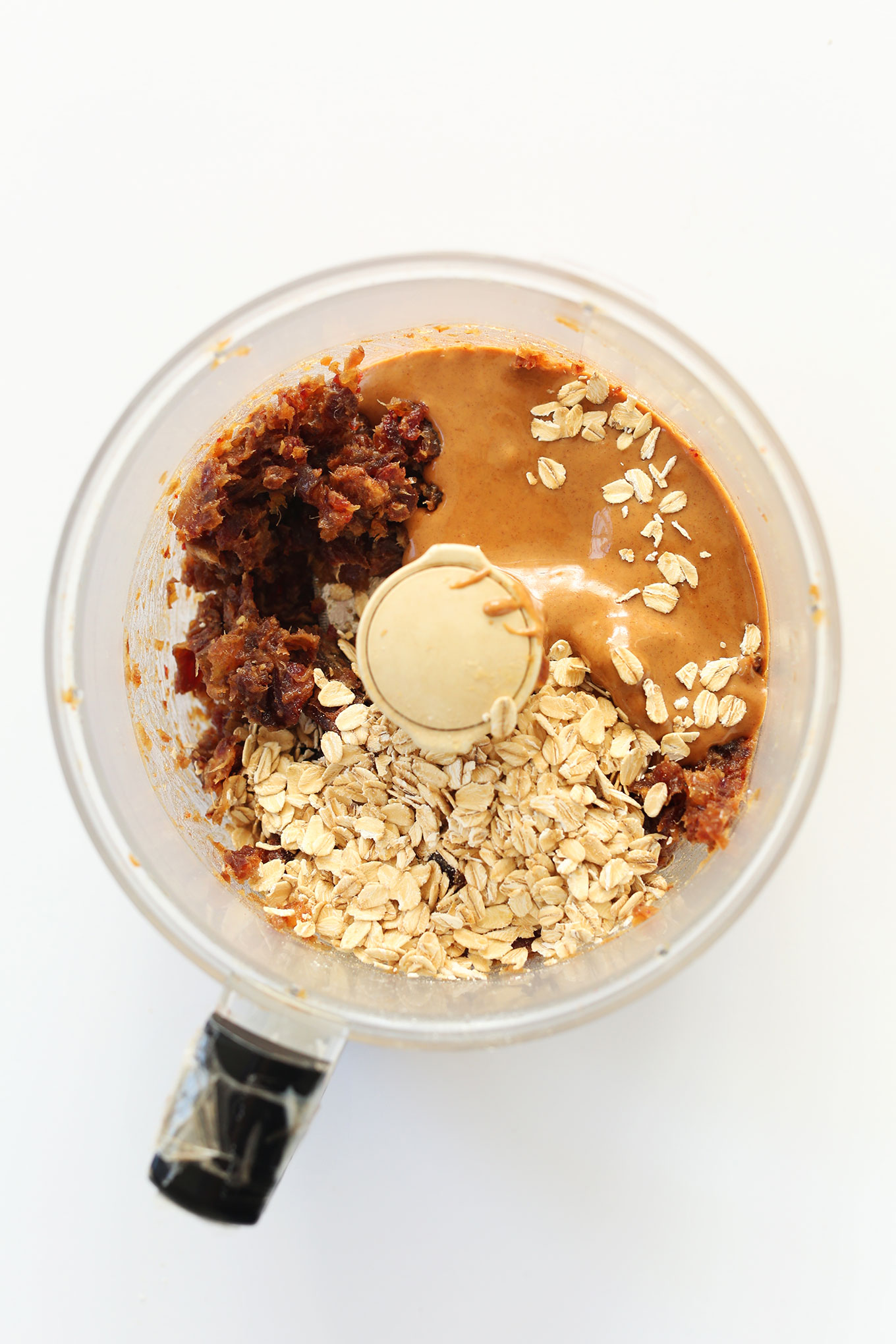Food processor with ingredients for making Copycat Peanut Butter Larabars