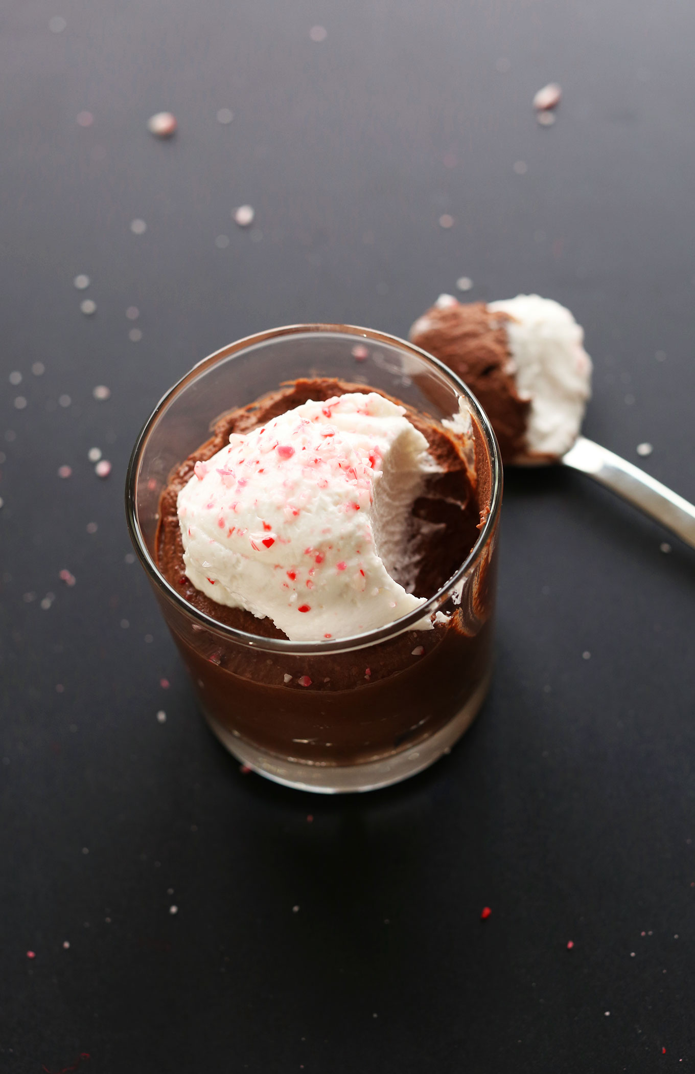Bite removed from a jar of delicious Vegan Dark Chocolate Peppermint Mousse