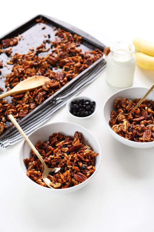 Baking sheet and bowls filled with our vegan grain-free homemade granola