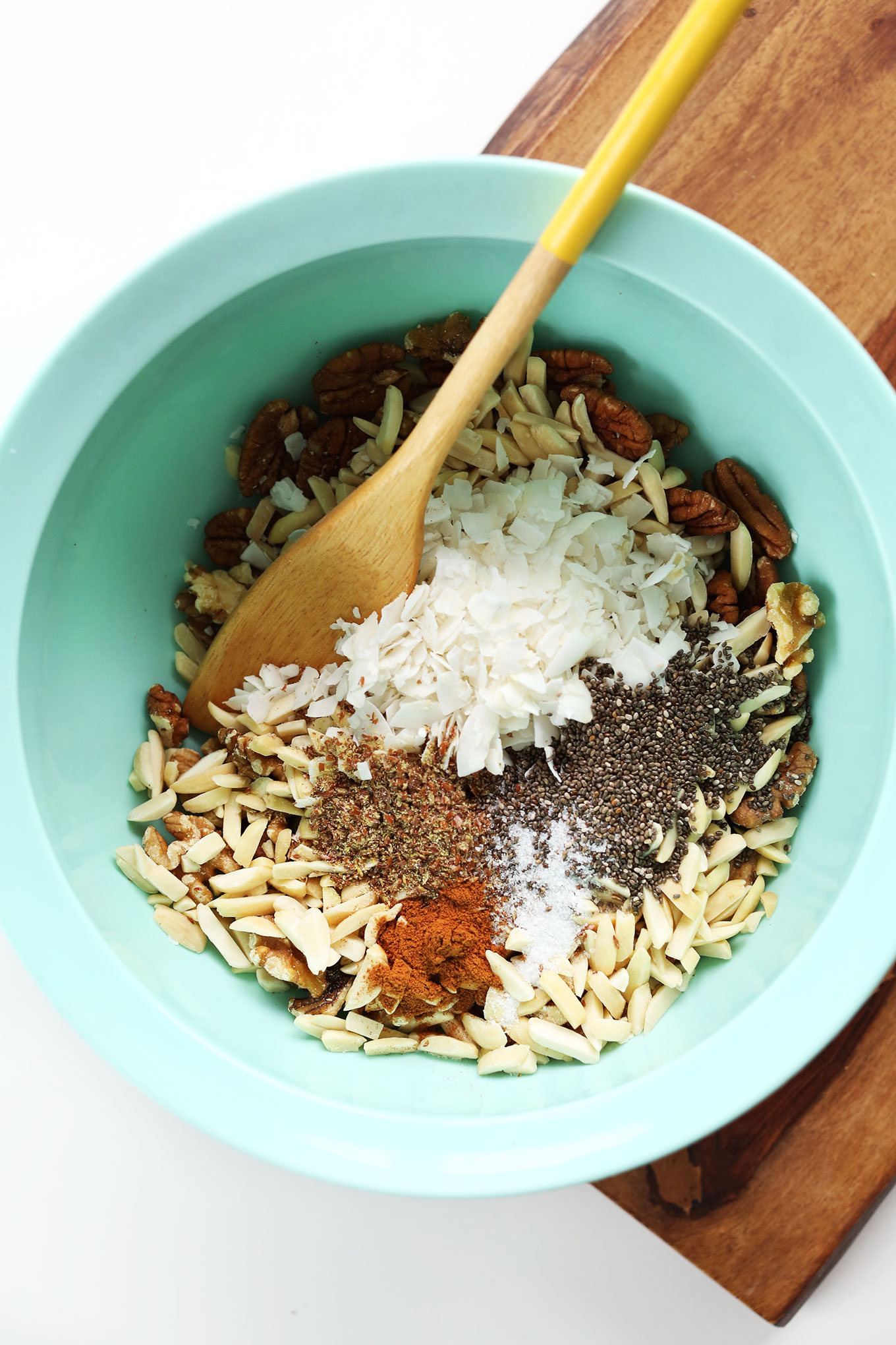 Mixing together ingredients for homemade vegan Grain-Free Granola