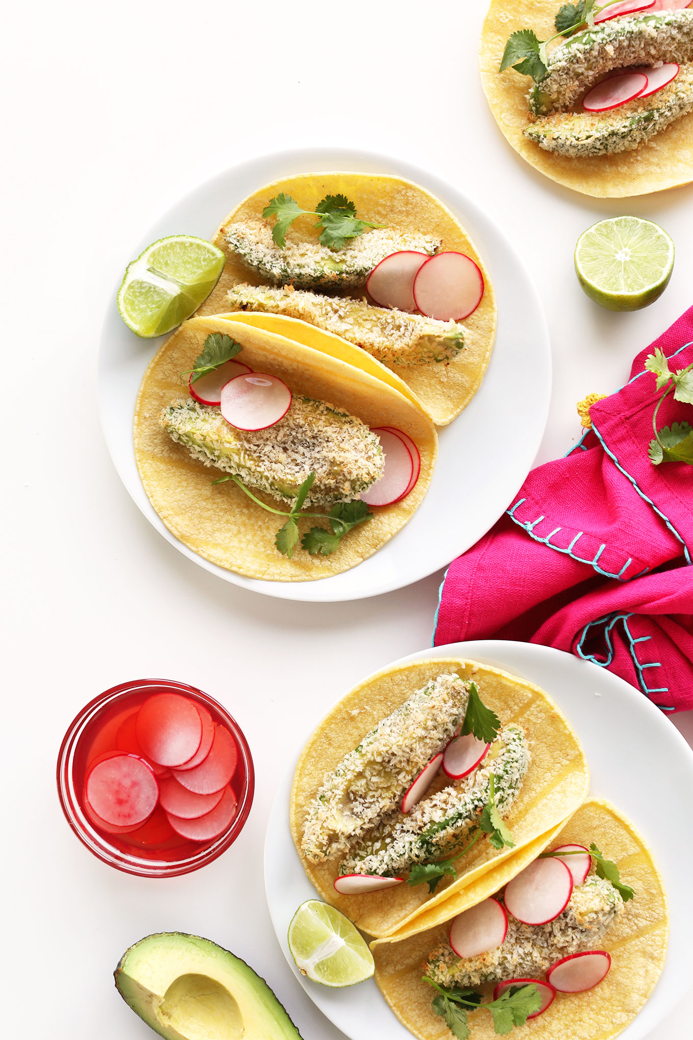Plates filled with our easy Panko Baked Avocado Tacos recipe