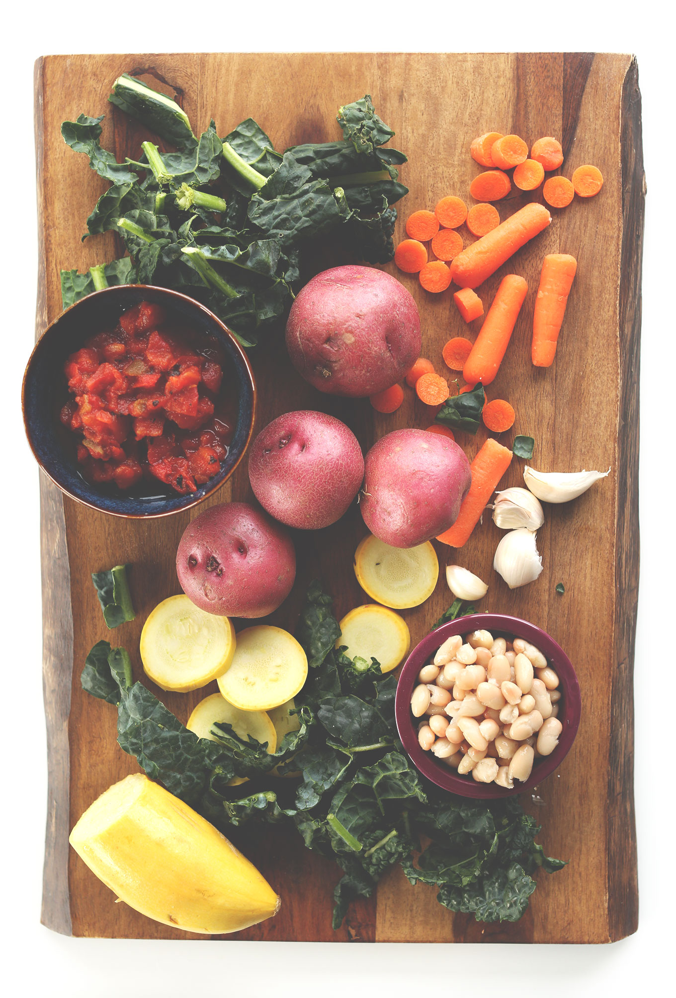 Cutting board with ingredients for making Easy Vegan and White Bean Soup