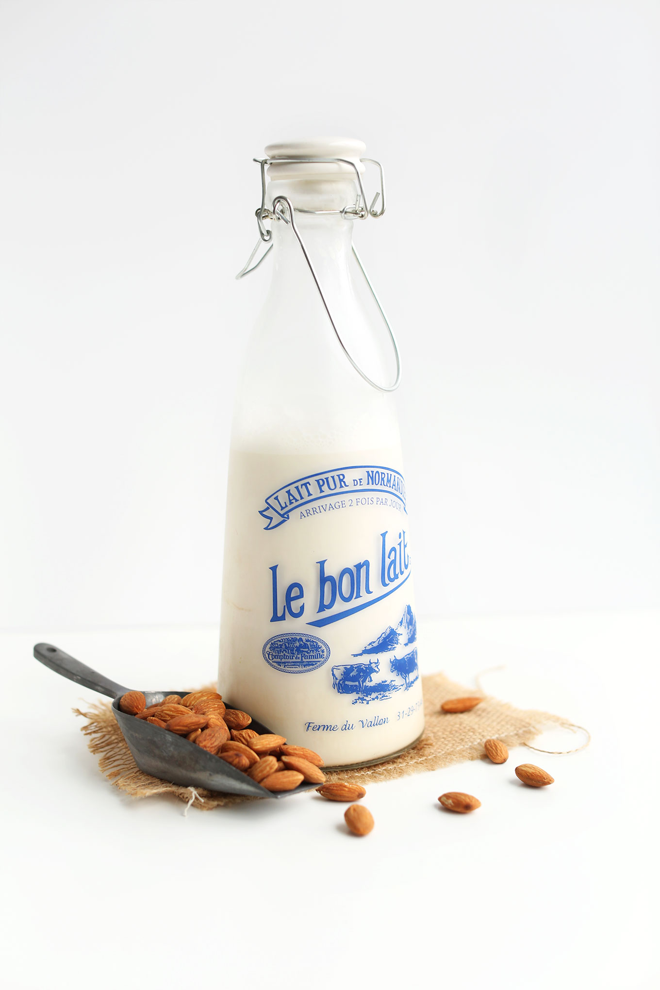 Old-fashioned milk jug filled with homemade almond milk