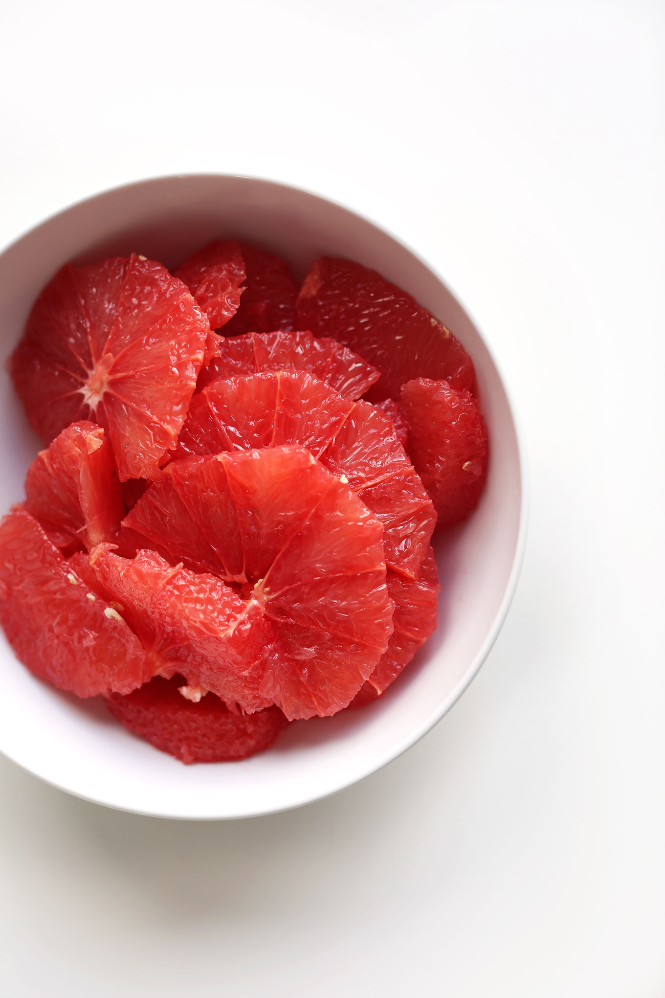 Bowl of fresh grapefruit slices for a Kale Citrus Salad Recipe