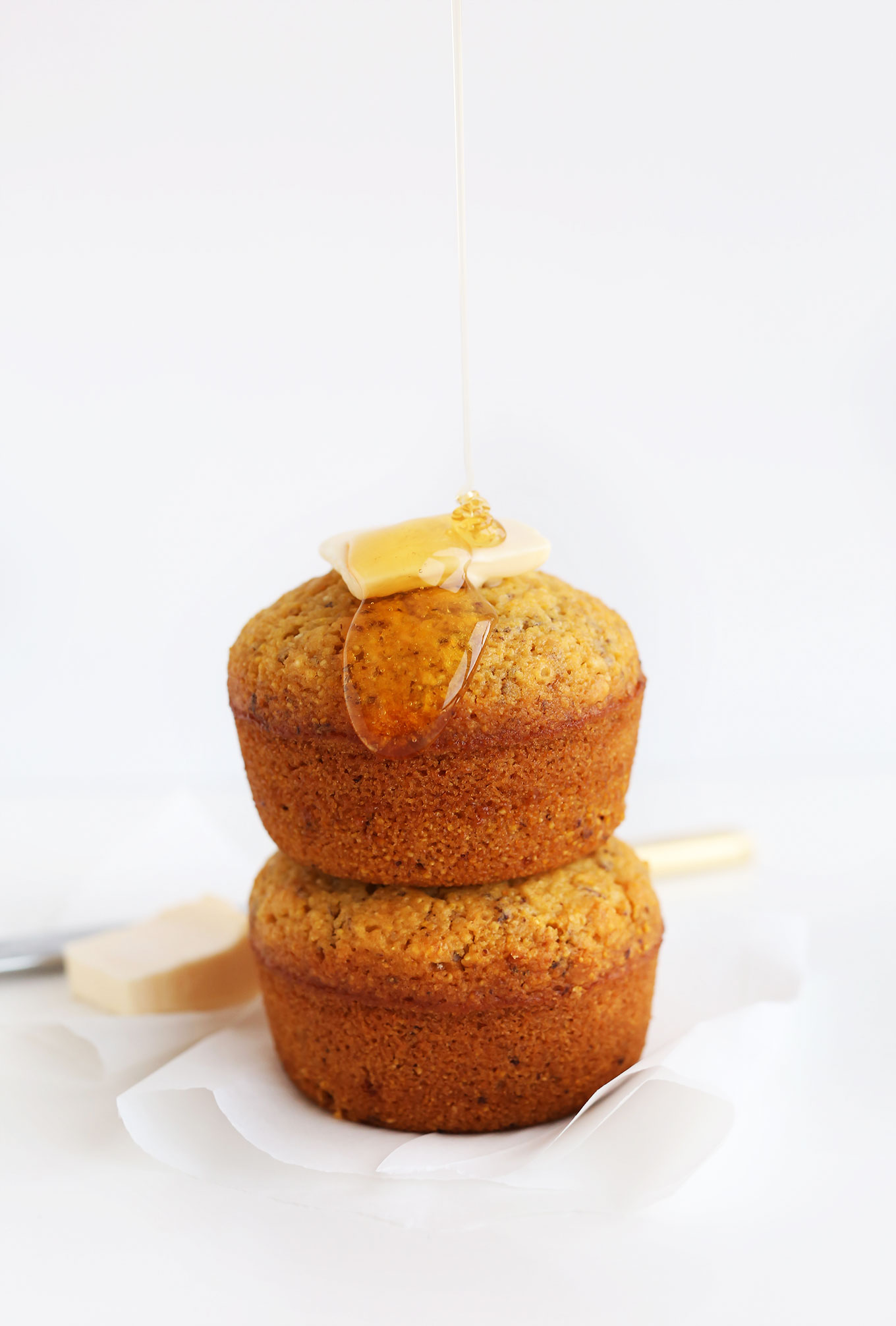 Stack of Vegan Cornbread with vegan butter and agave