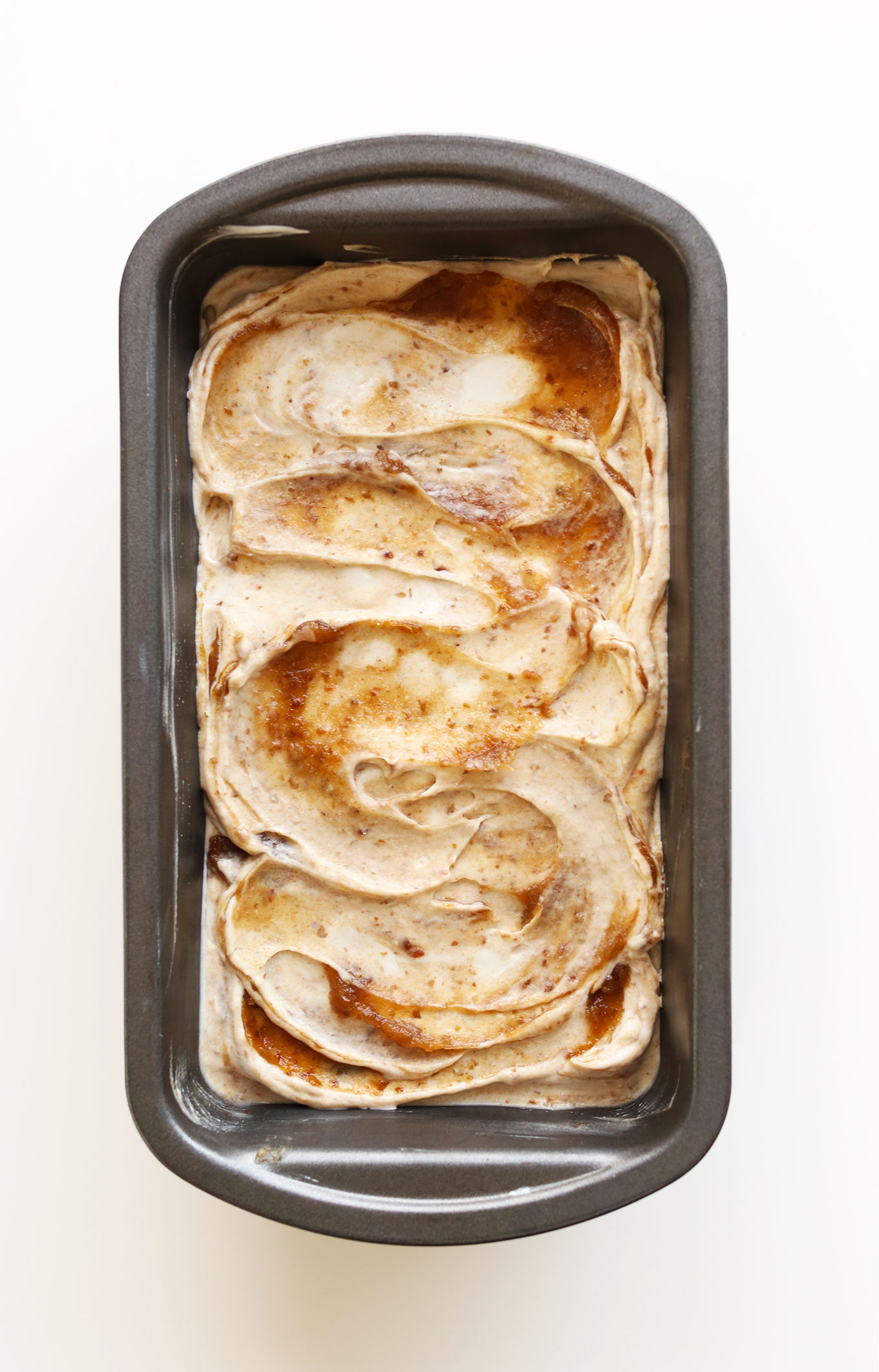 Baking pan filled with our Vegan Coconut Ice Cream with a Sea Salt Caramel swirl