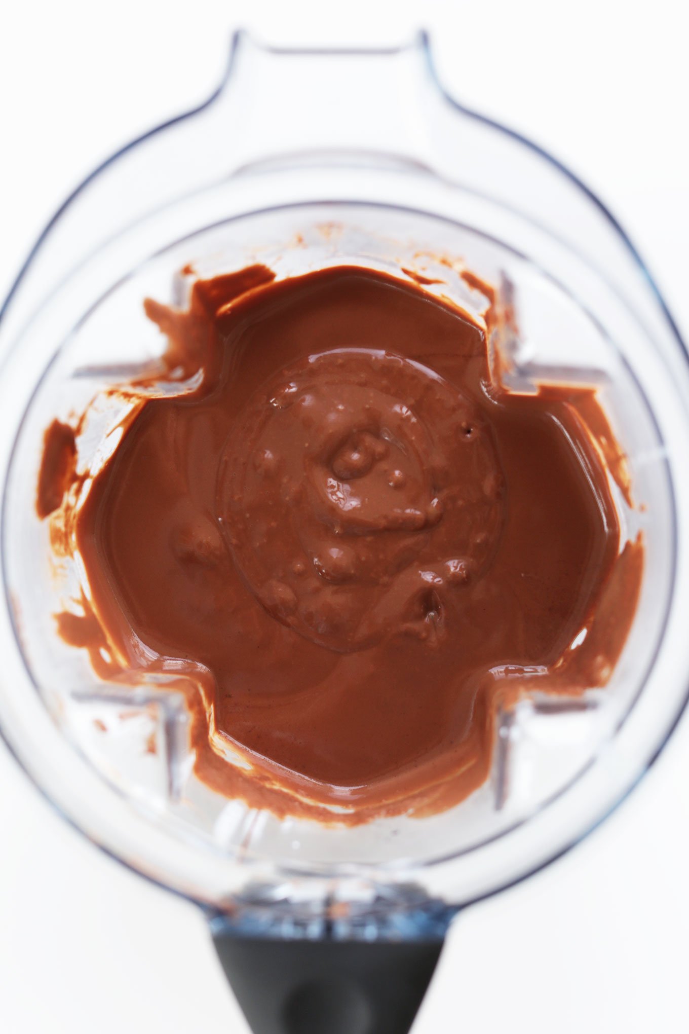 Blender with creamy filling for making our Vegan Chocolate Cheesecake recipe