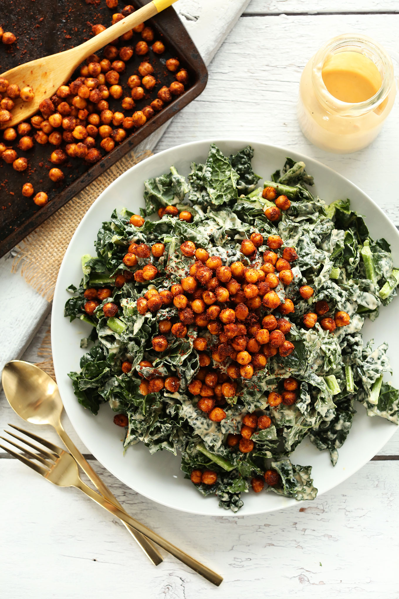 Dinner plate filled with our quick vegan Garlicky Kale Salad with Tandoori Spiced Chickpeas