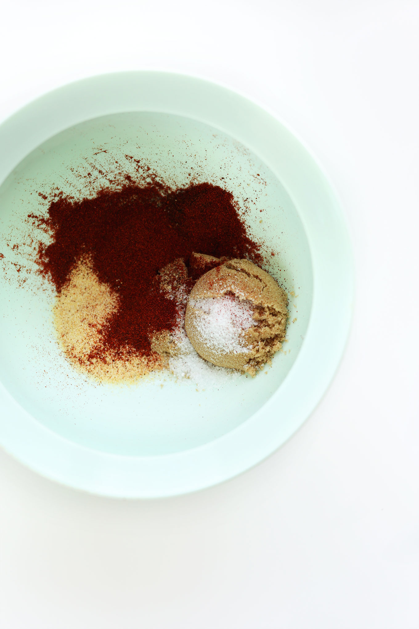 Mixing bowl filled with homemade BBQ seasonings